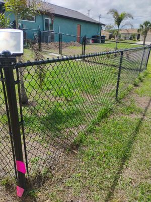 Black Vinyl-Coated Chain Link Fence and Rolling Gate Installation in North Port