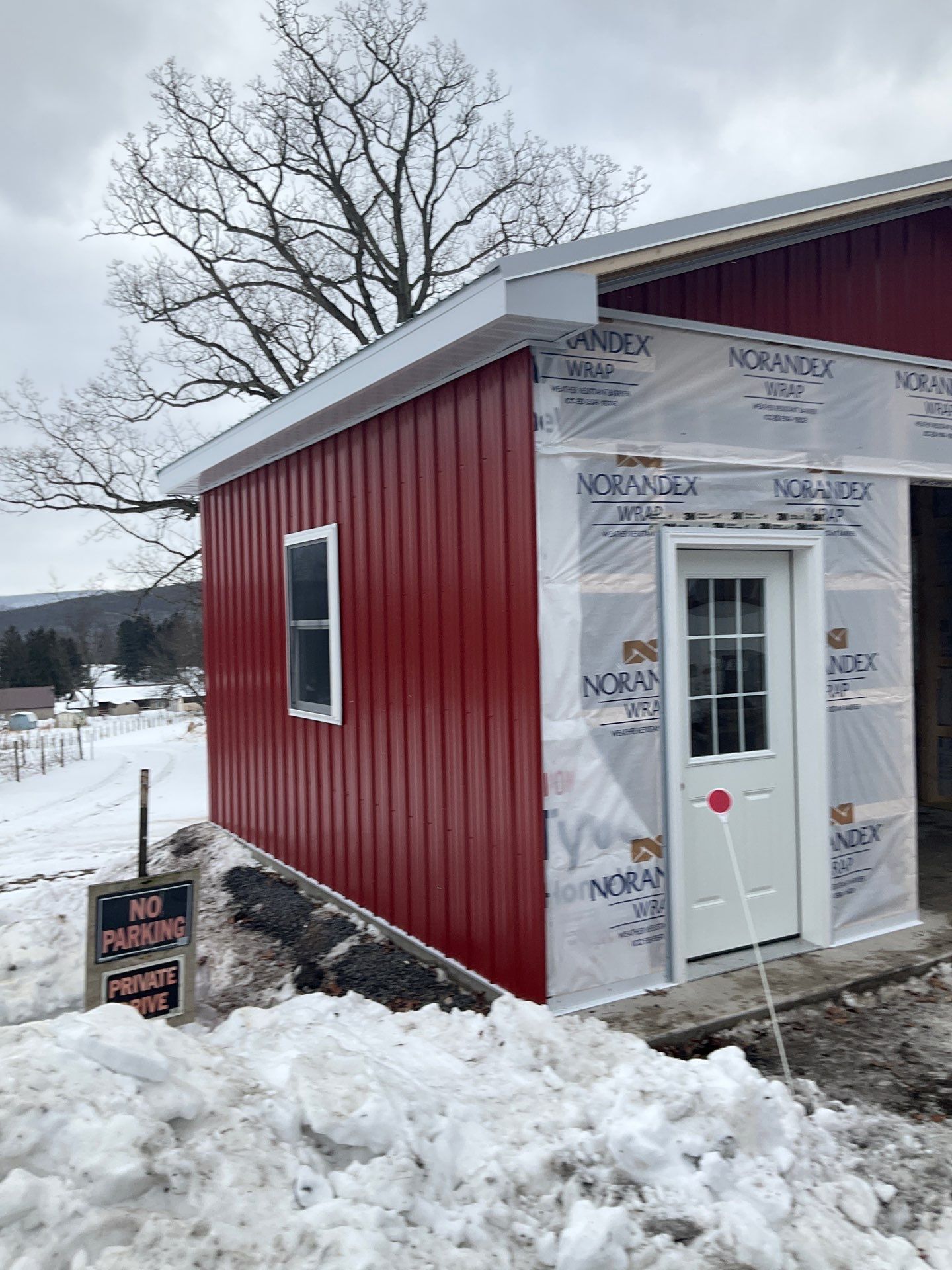 New Red Metal Garage Construction and Residential Window Replacement in Ashland by Esh Builders