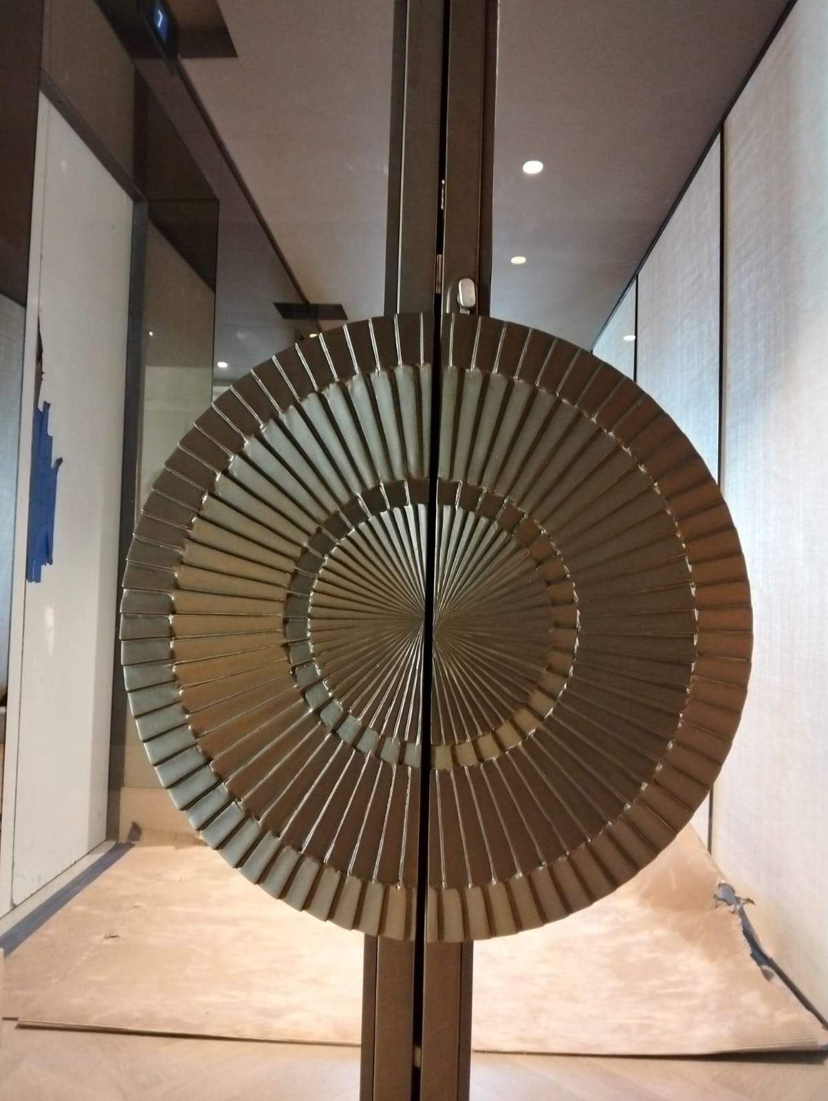 Modern Black Frame Double Door Installation with Custom Radial Hardware by Solara Custom Living