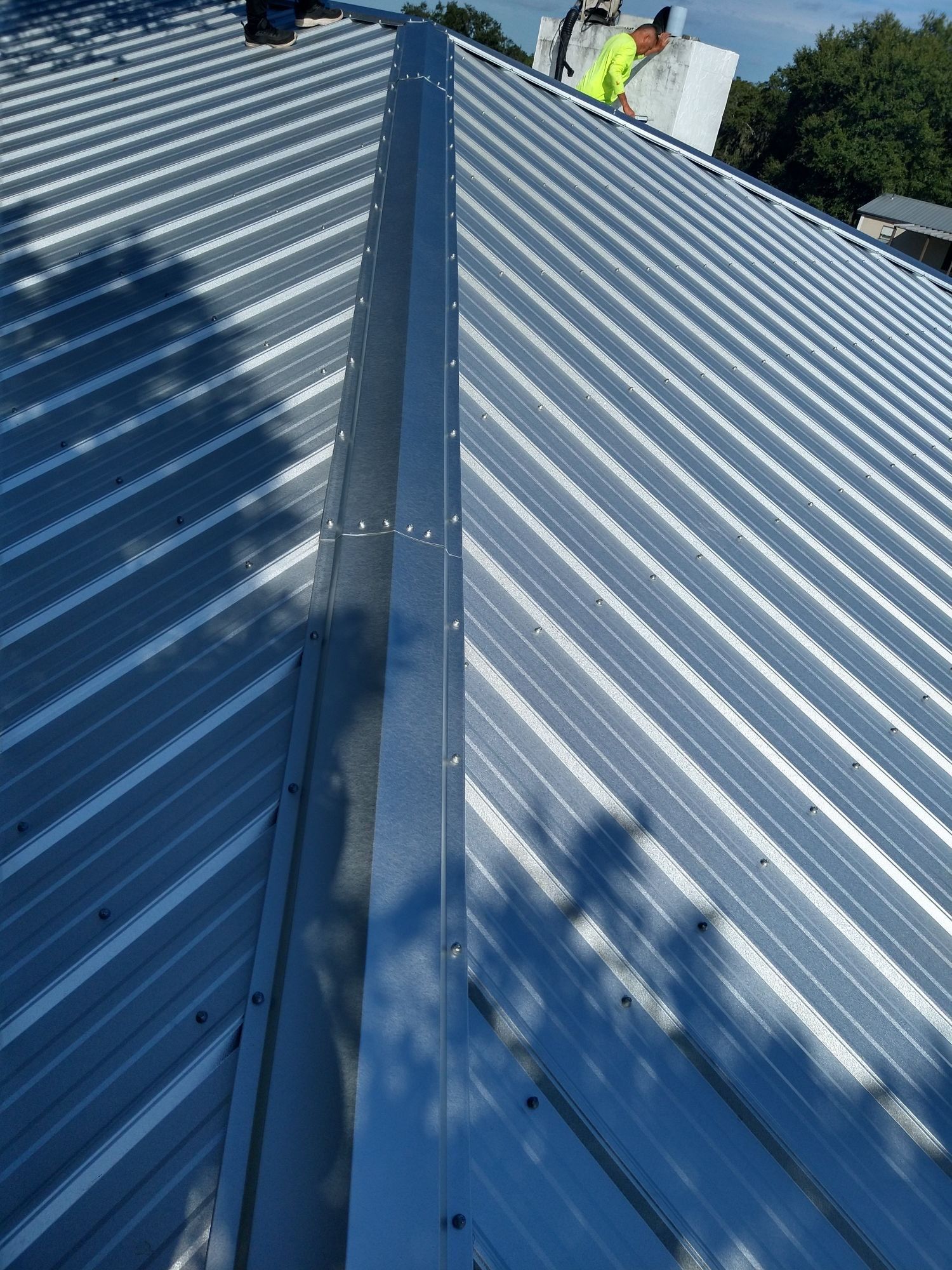 Residential Roofing Installation using 26 GA Rib Panel Galvalume by 1st Class Roofing, Inc.