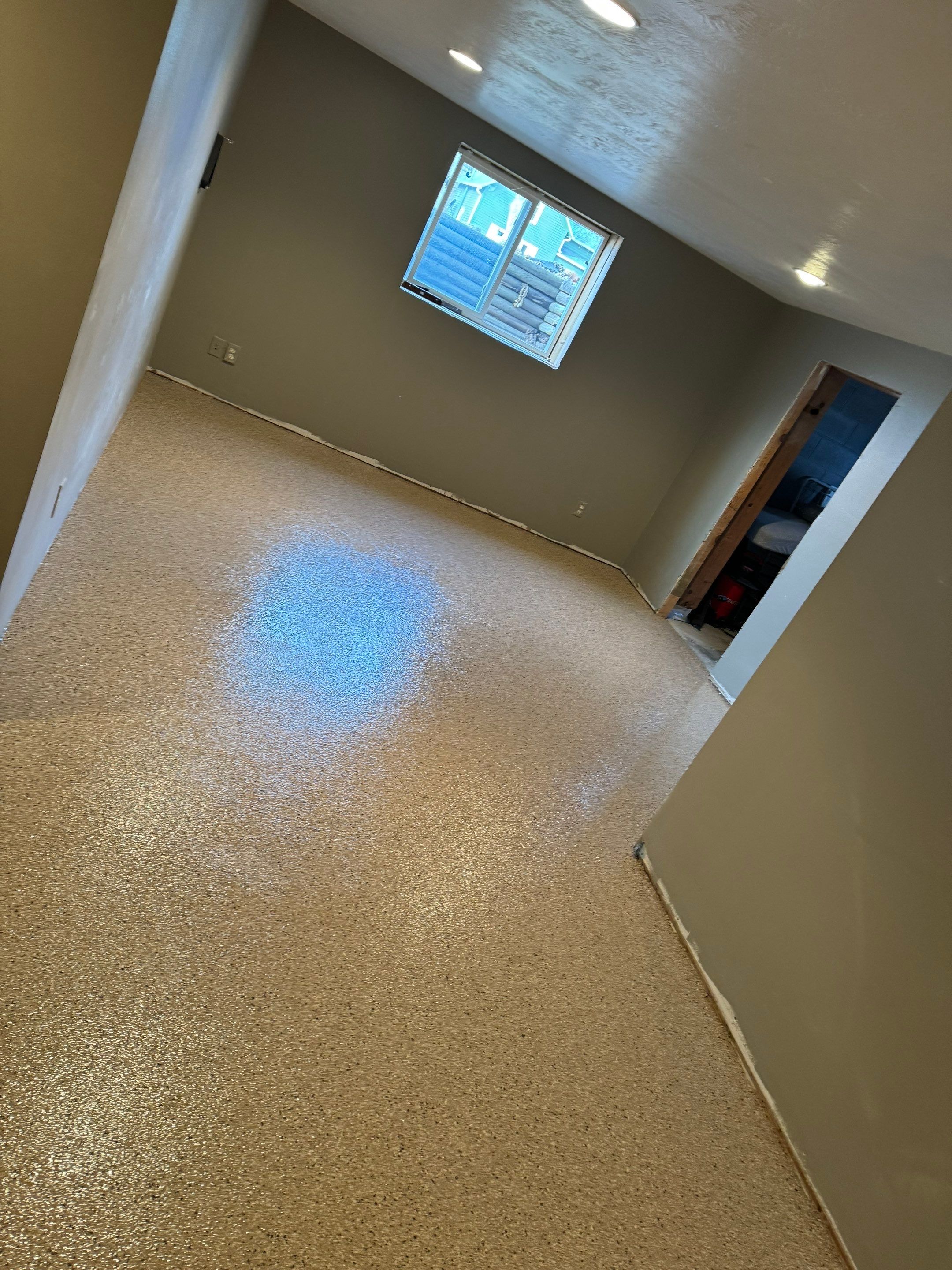 Custom Multi-Fleck Epoxy Floor Coating for Residential Basement by Select Painting, Coatings & Garage Cabinets