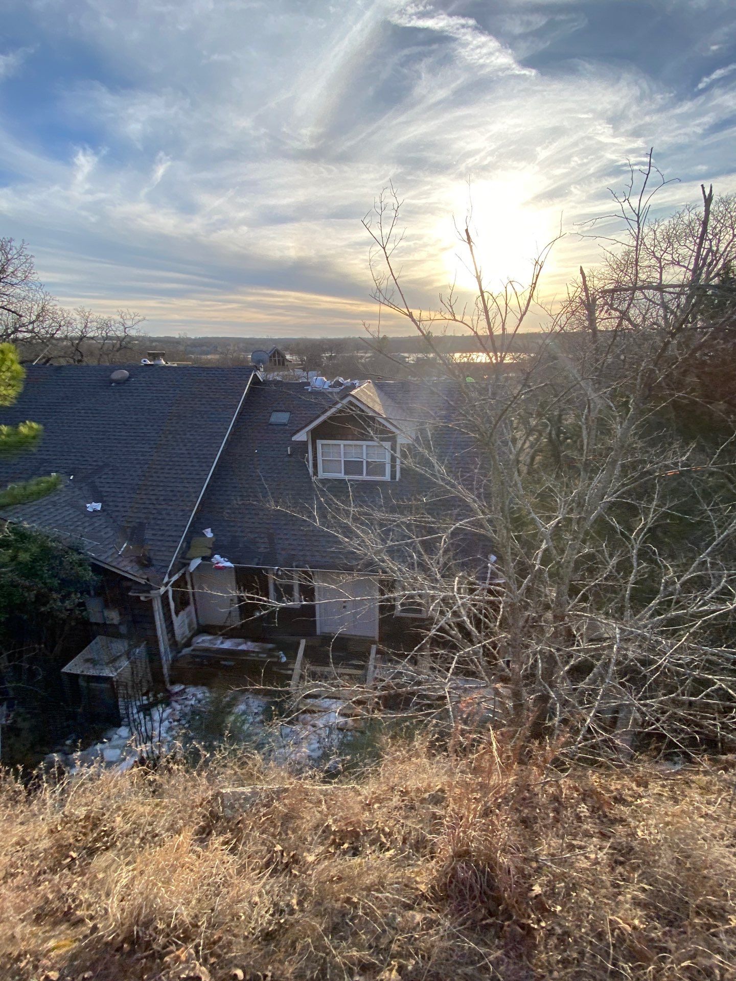 Roof Replacement on a private lake near Ardmore by BANA Roofing and Solar Supply