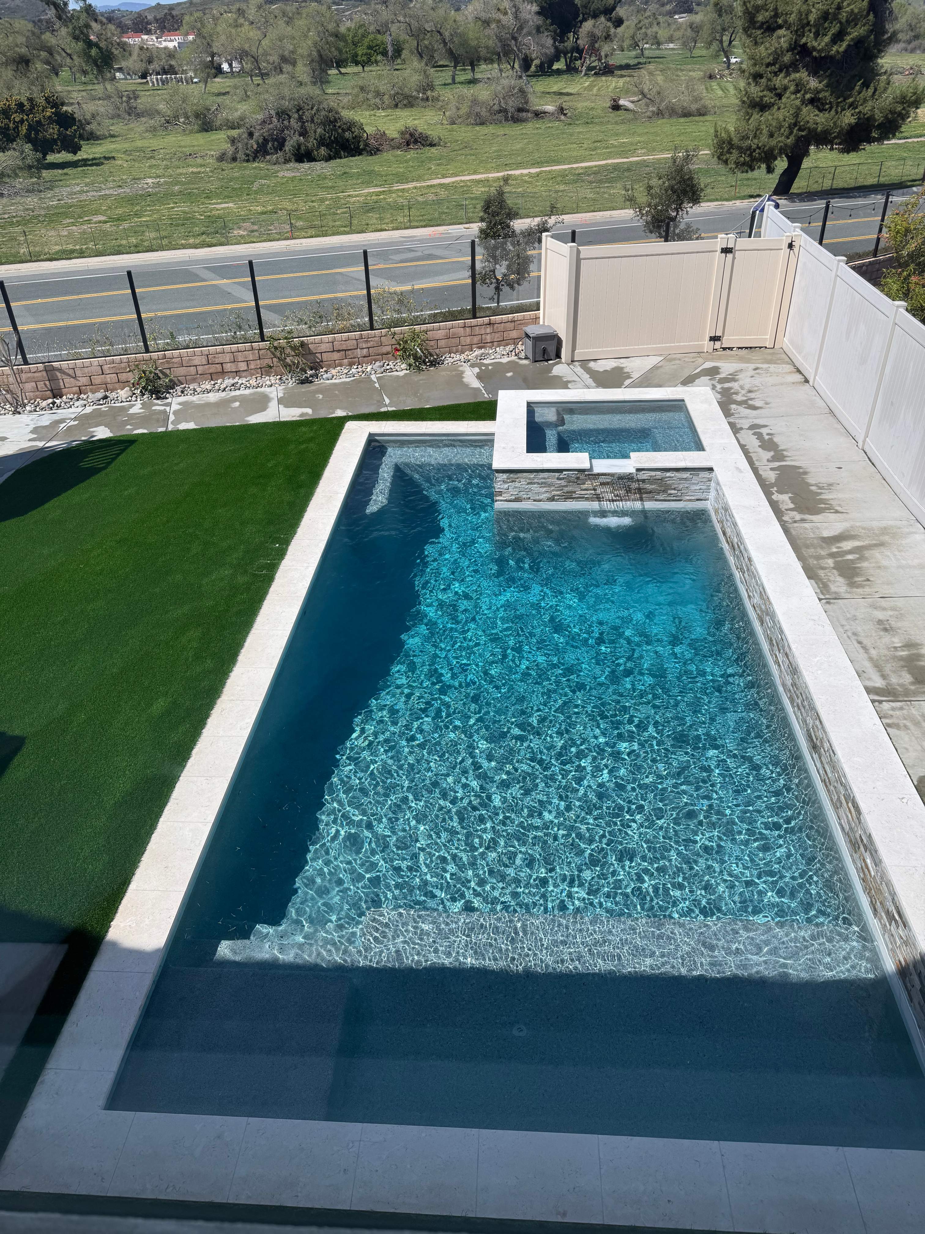 Beautiful pool and spa with water feature by Premier Pools and Spas Temecula