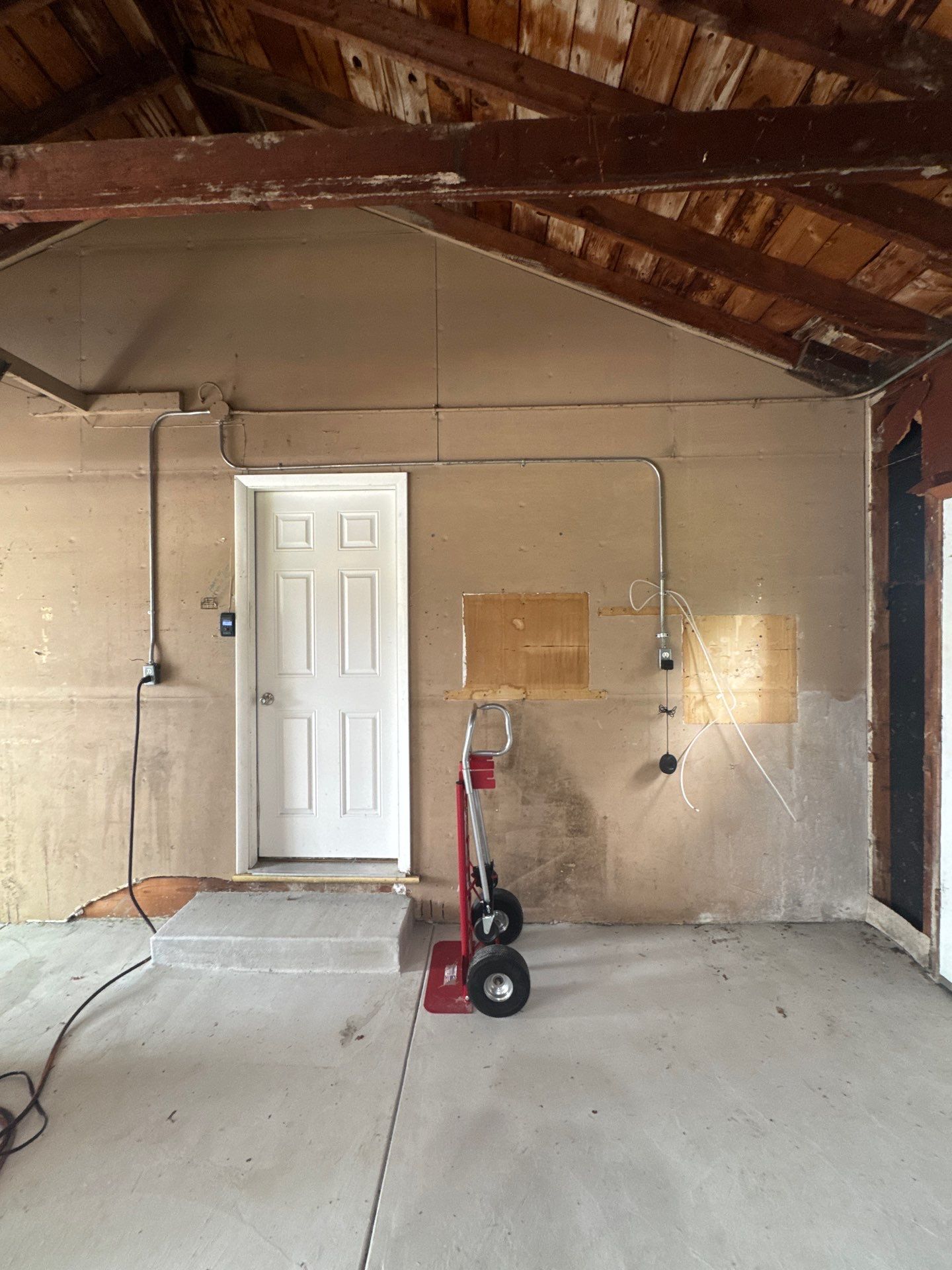 Bayside Garage Interior Remodel with Custom Epoxy Floor Coating by OCS Contracting Services