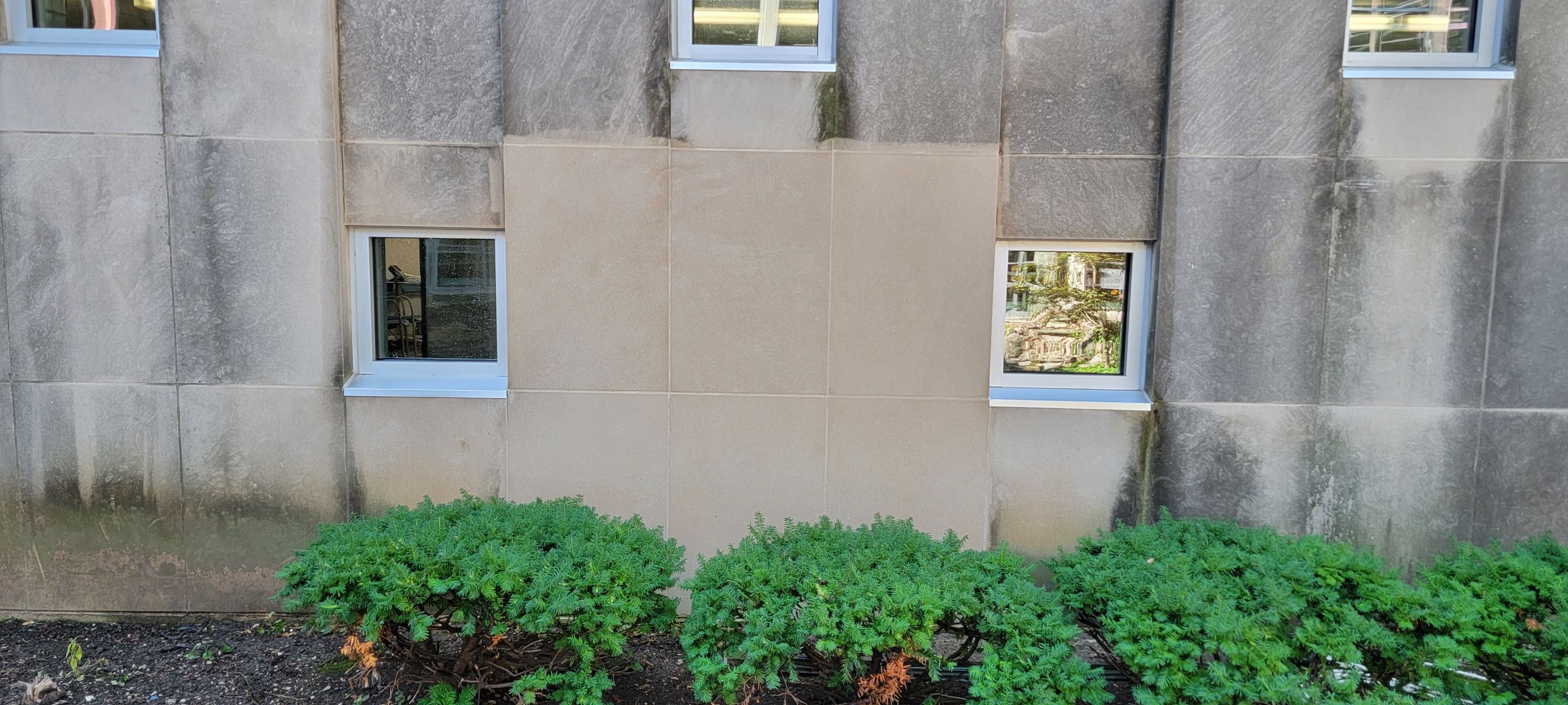 Courtyard pressure washing difficult access.  by Northern Power Washing LLC.