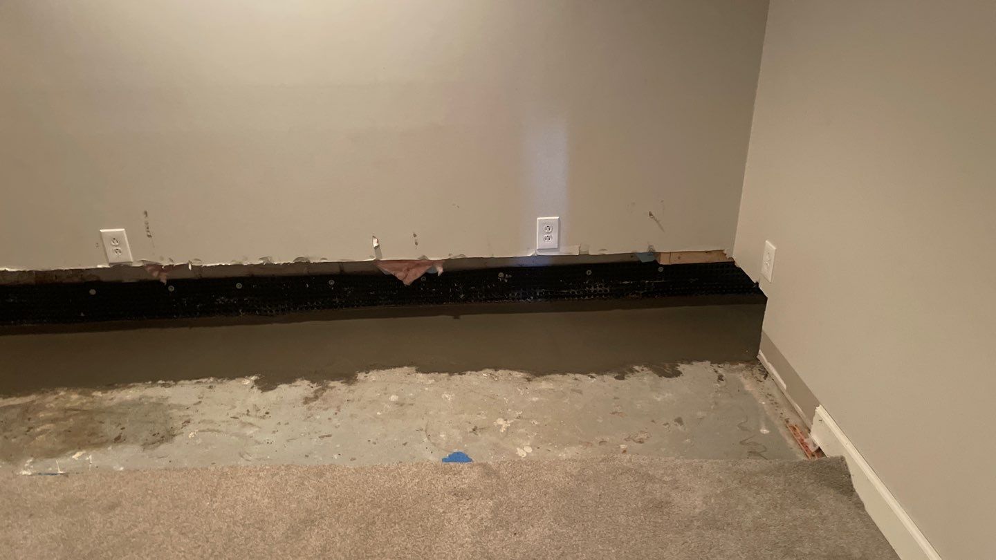 Interior Drain Tile in a Finished South Minneapolis Basement by Waterproofing Northeast