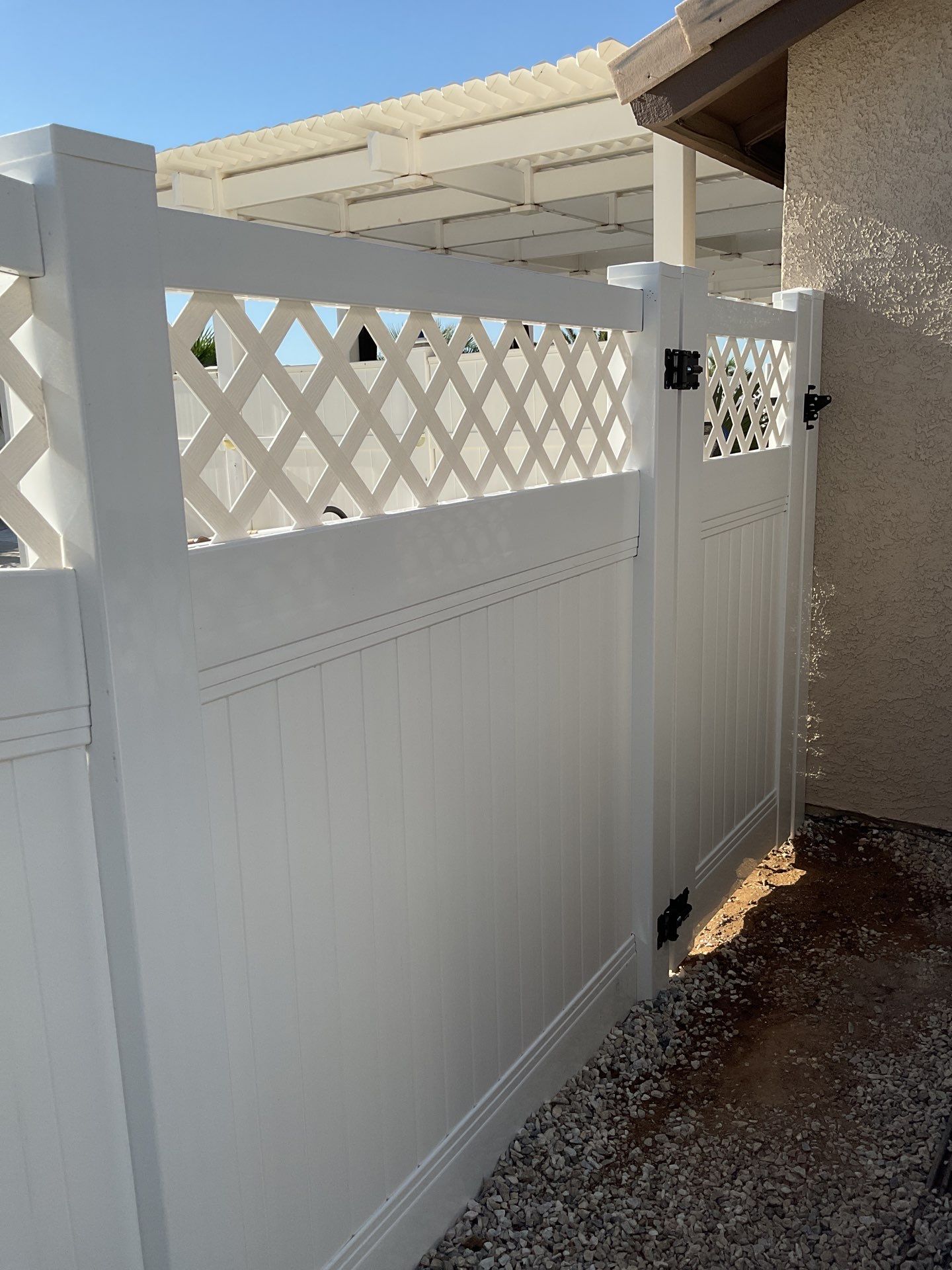 Lattice Vinyl with Privacy Vinyl Fence by Fence Guys Inc.