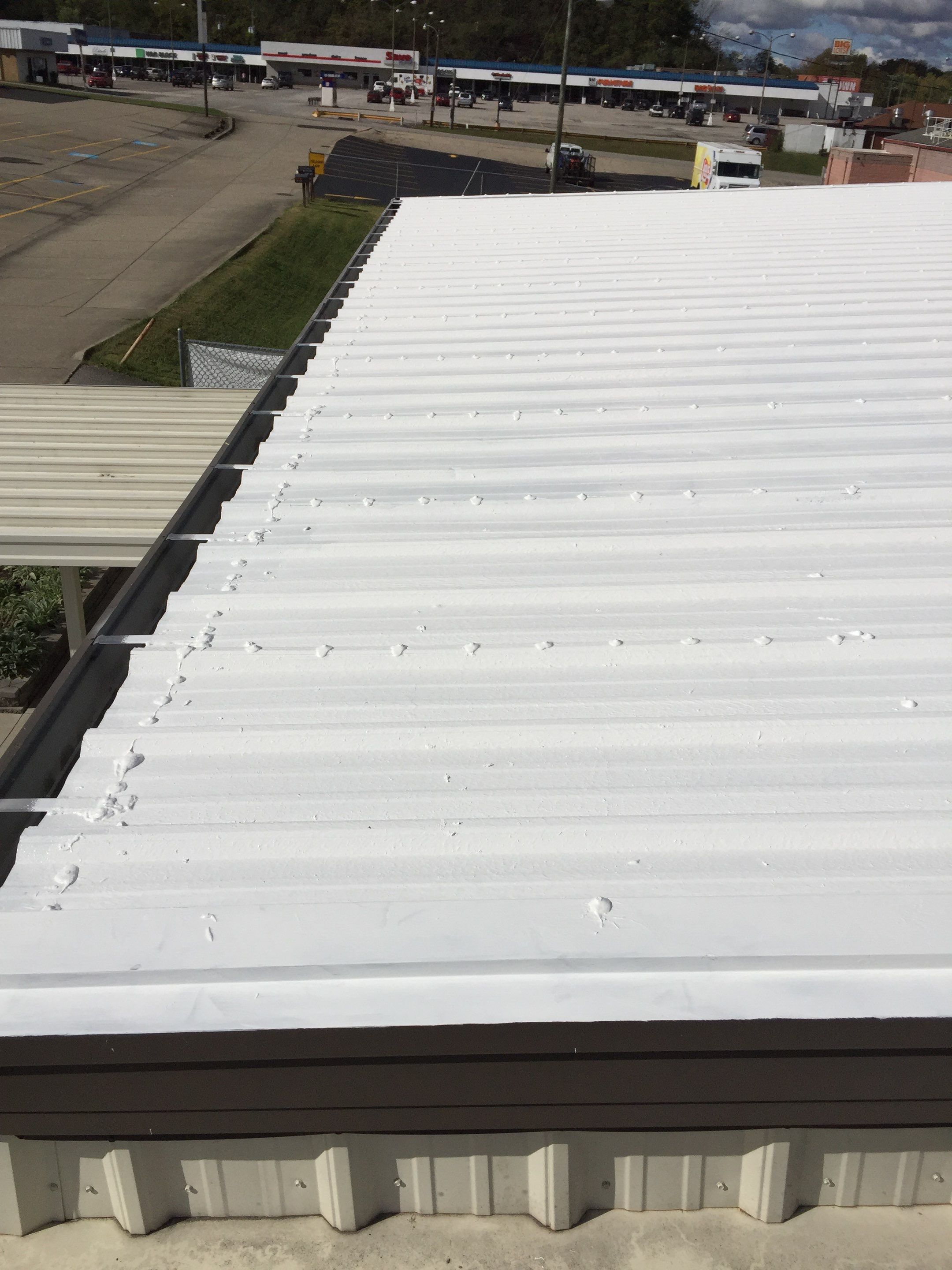 Commercial Roof Coating using Gaco Silicone Roof Coating by Secure Construction Company Inc
