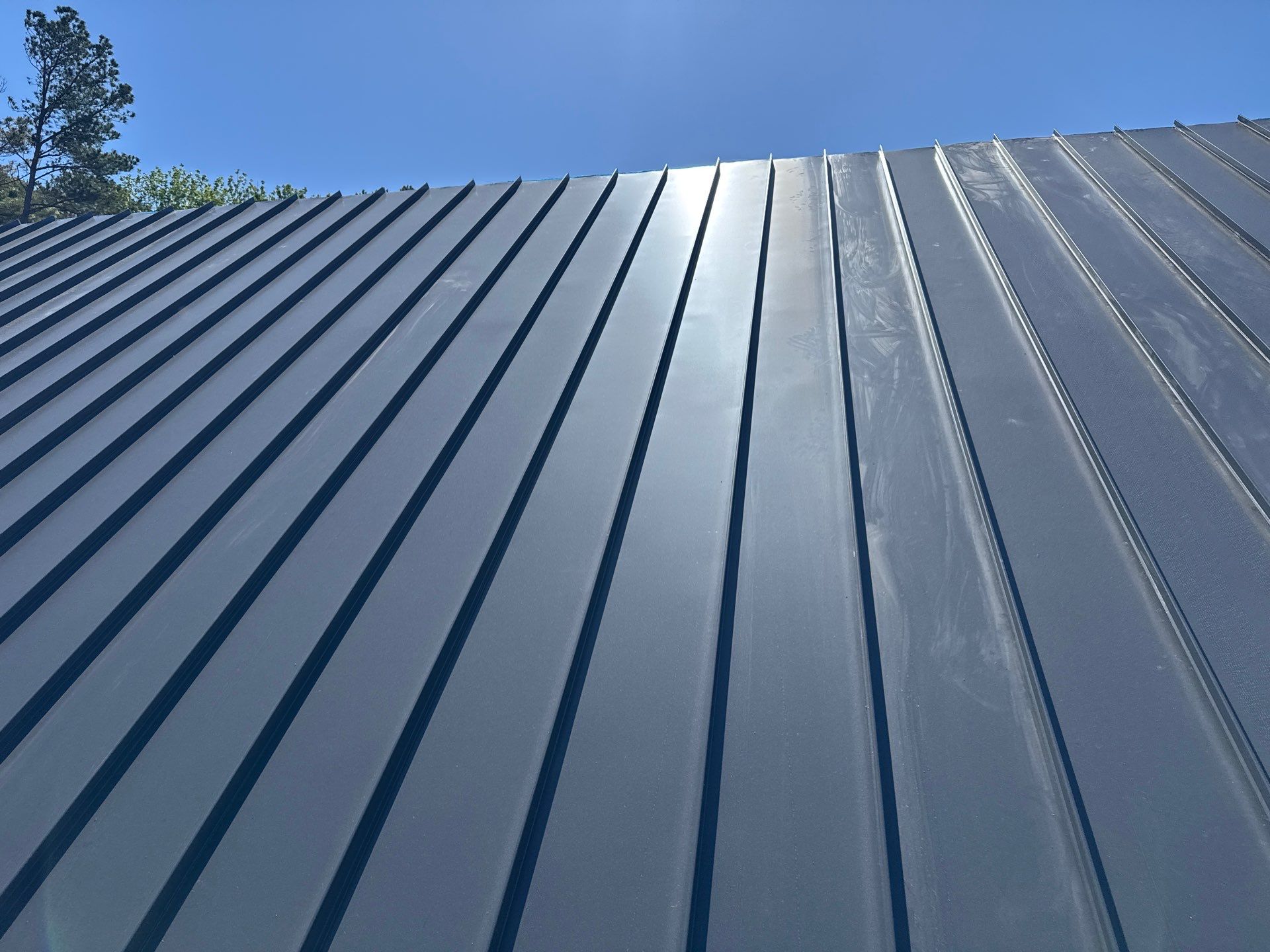 Custom New Construction Home Featuring Standing Seam Metal Roofing in Port Haywood by Cade Construction