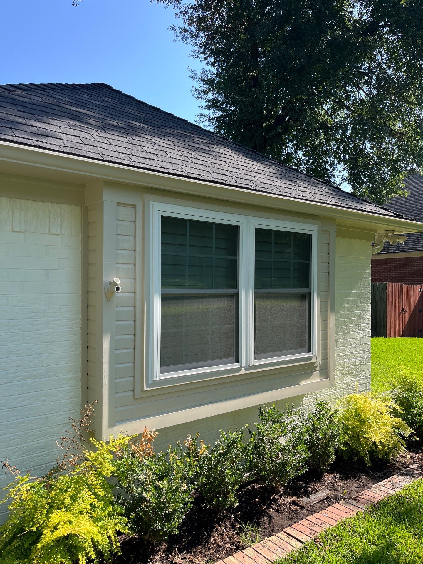 Exterior Painting in Tyler, TX | Brick House with White & Blue Finish by Quality Coats Painting