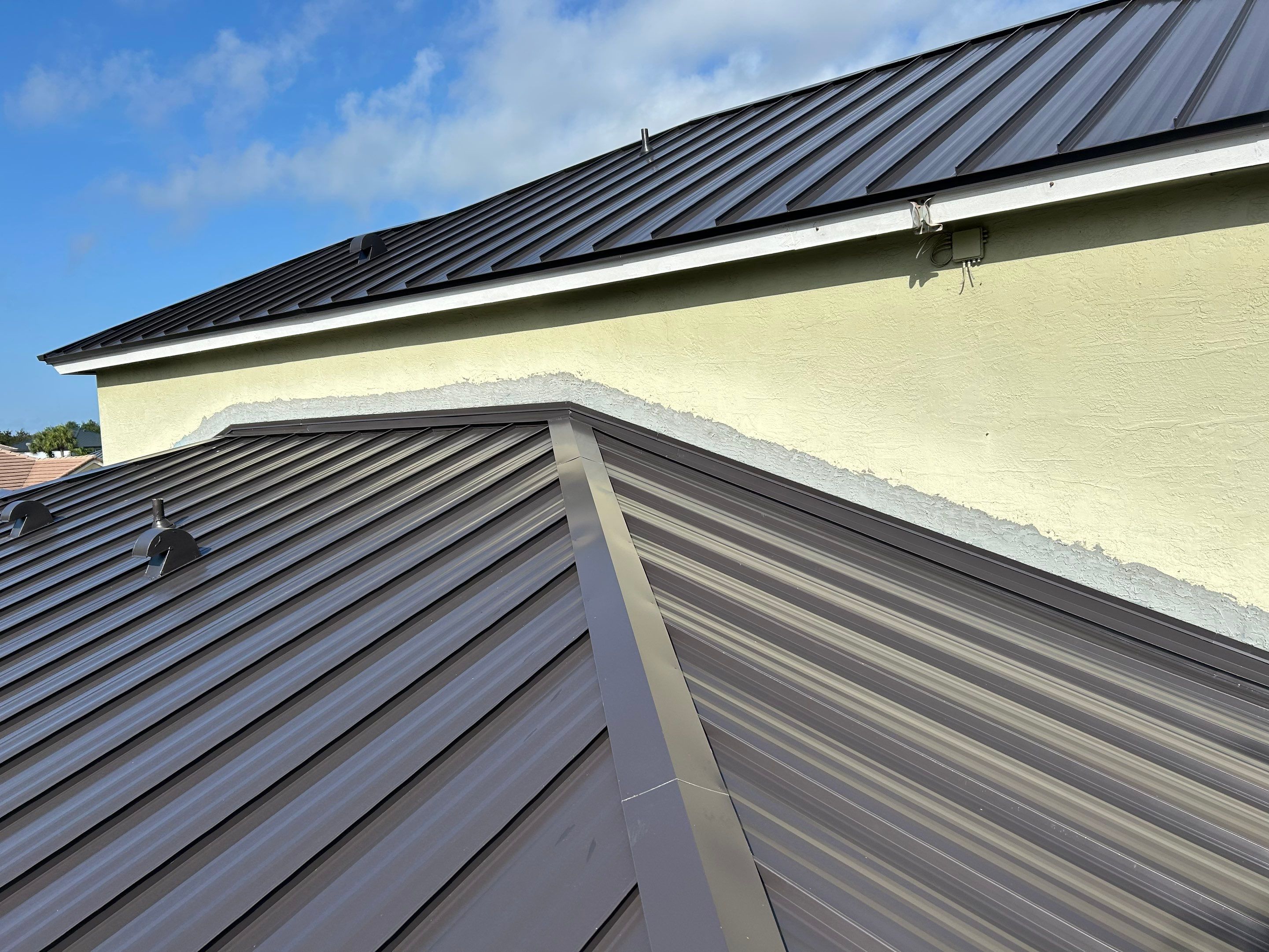 24ga 1.5" Mechanical Seam Dark Bronze by Total Roofing System The Metal Roof Experts
