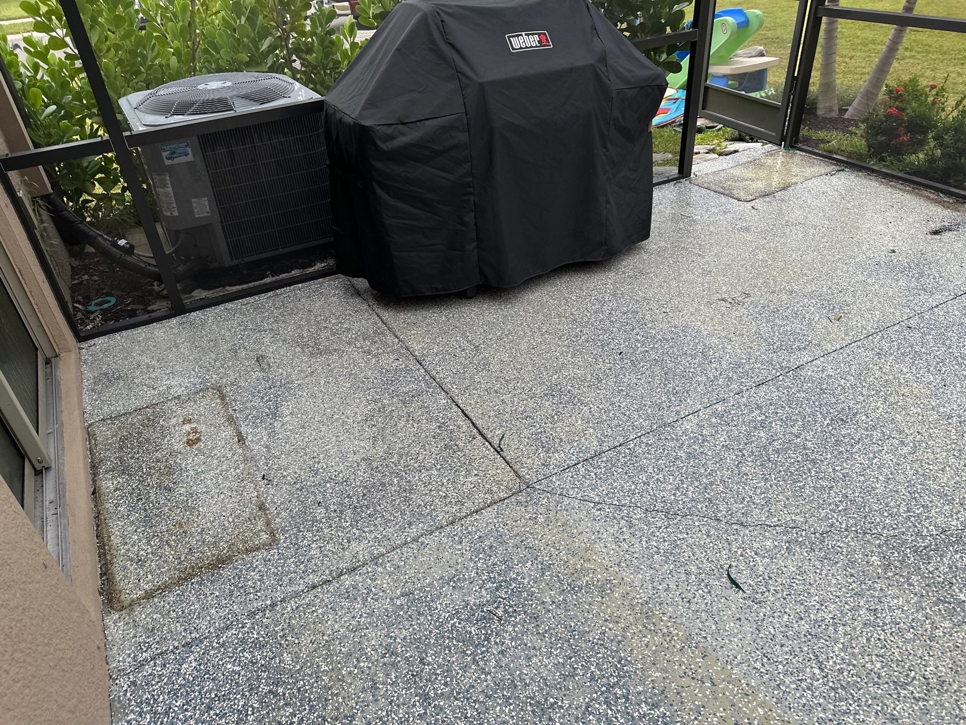 Lanai & Patio Cleaning with Epoxy-Coated Concrete Floor in Trevesta Community, Palmetto, FL | Sunshine AquaWash by Sunshine AquaWash