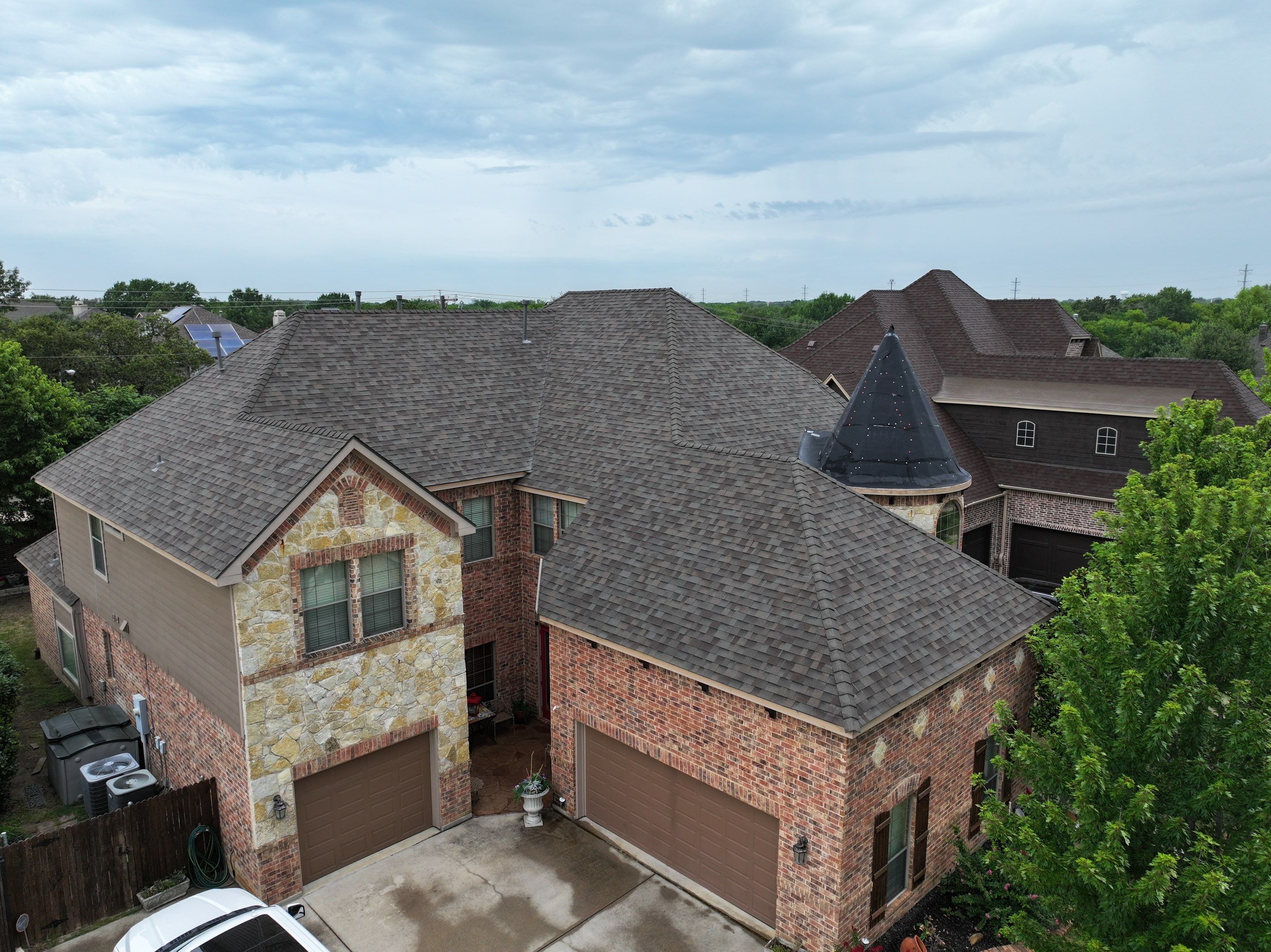 Installing Custom copper turret and Malarkey Vista Class 4 shingles Hail Damage Upgrade by Becker Roofing and Exteriors