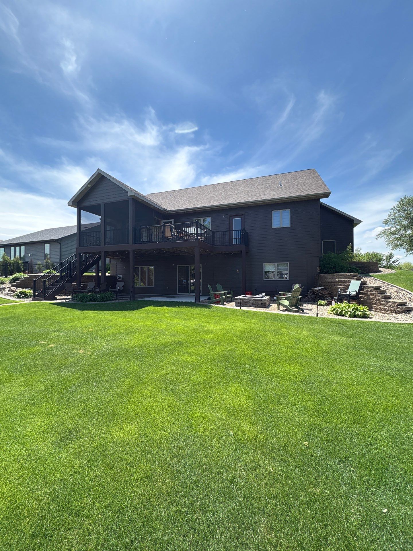 Full Exterior Renovation with Stone Veneer and Composite Decking by Select Painting, Coatings & Garage Cabinets