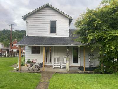 House Siding Renovation with White Vinyl in Bridgeville