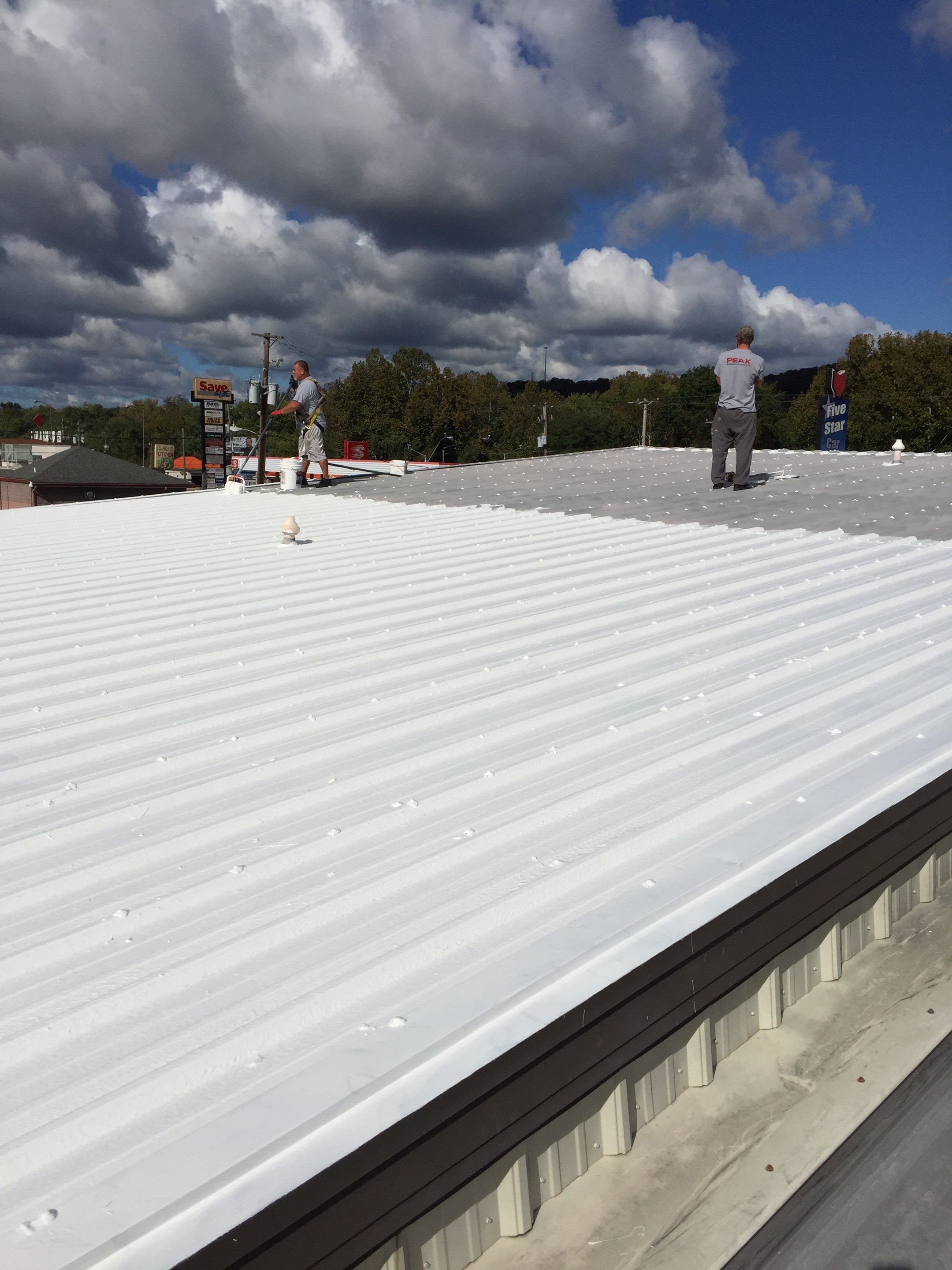 Commercial Roof Coating using Gaco Silicone Roof Coating by Secure Construction Company Inc