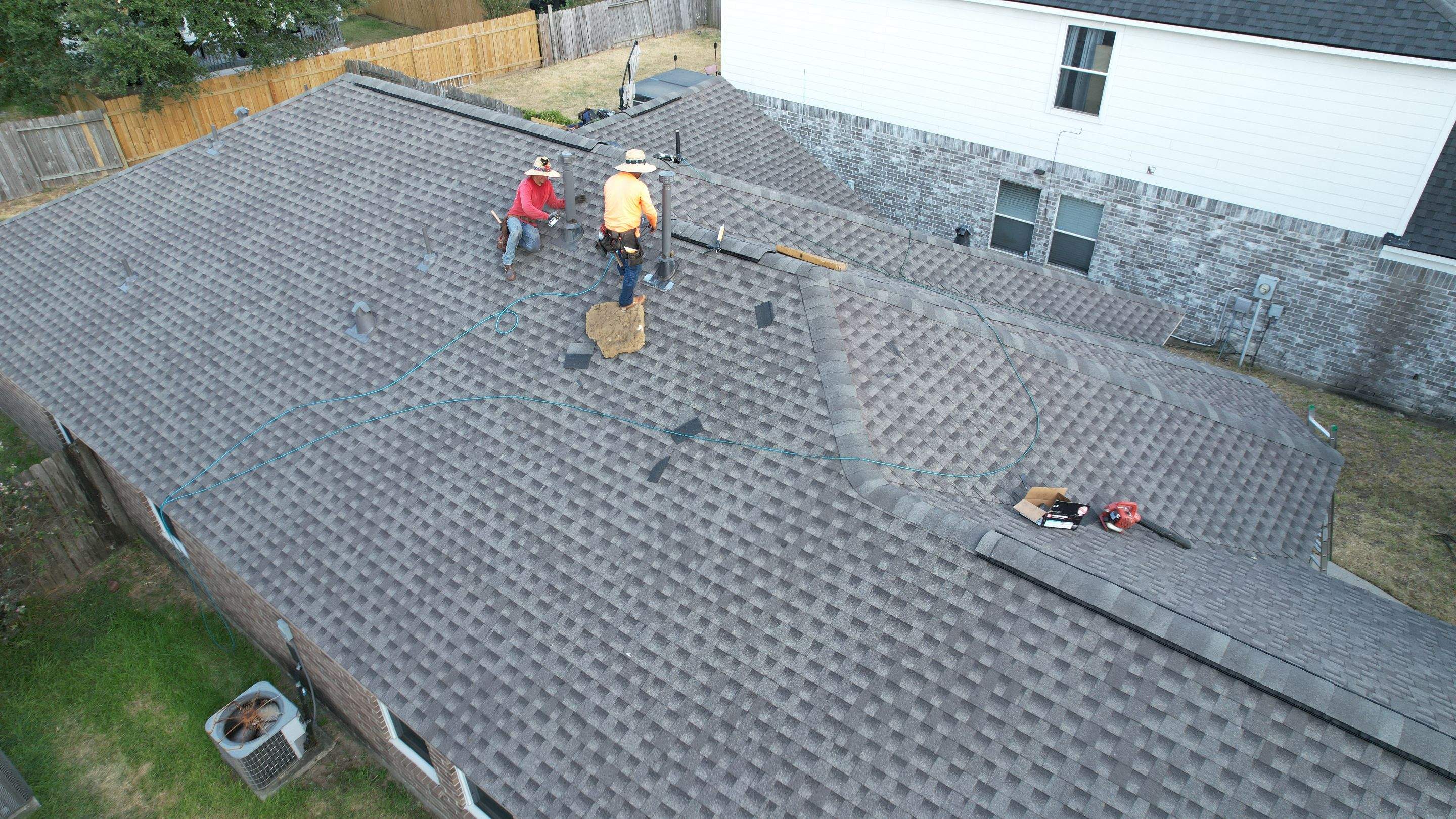 Full Roof Replacement on Two-Story Brick Home — Spring, TX by PL Roofing & SB Roofing, LLC.