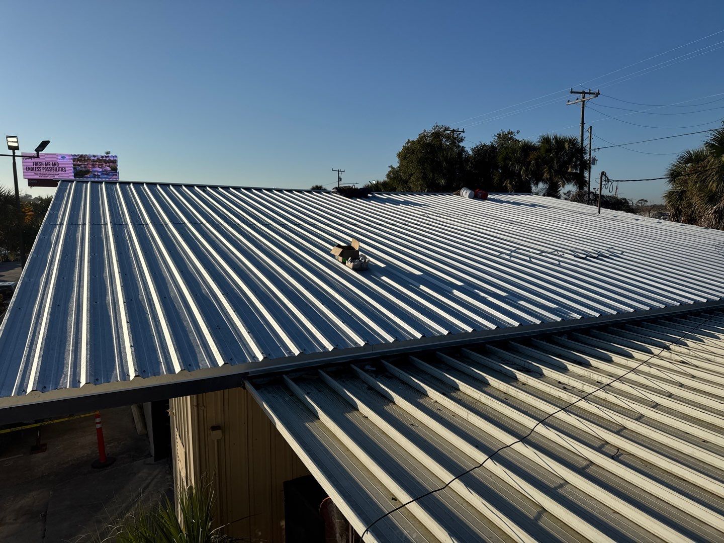 Commercial Metal Roof Replacement for Industrial Warehouses in Orlando by Tip Top Roofing Co., Inc.