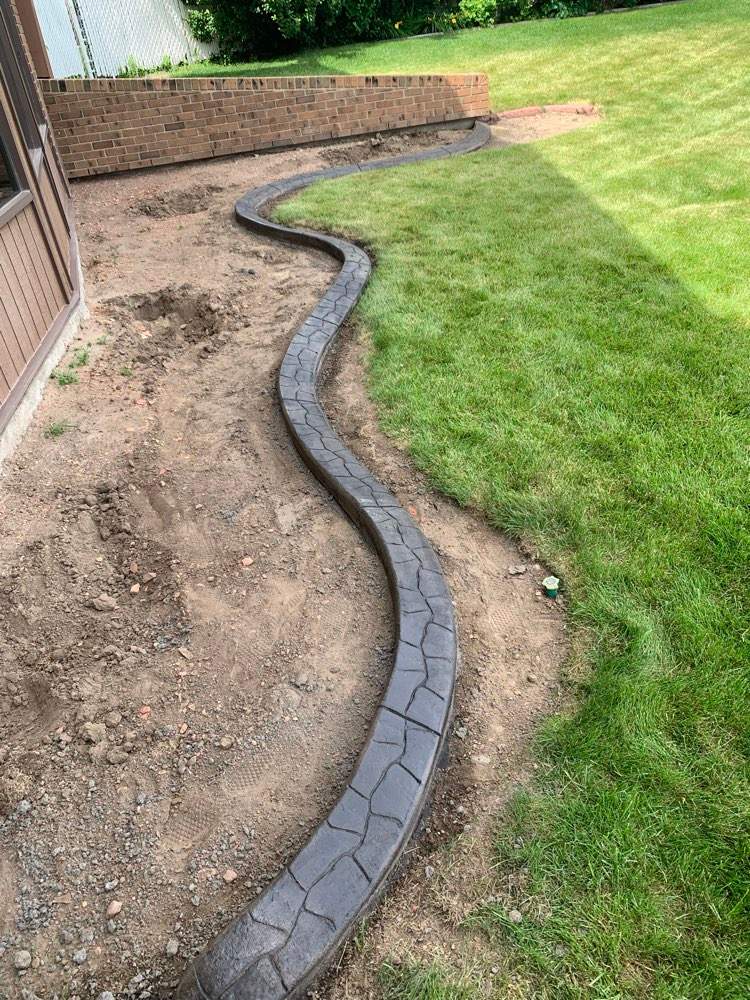 Decorative Stamped Concrete Garden Border Installation in Medicine Hat