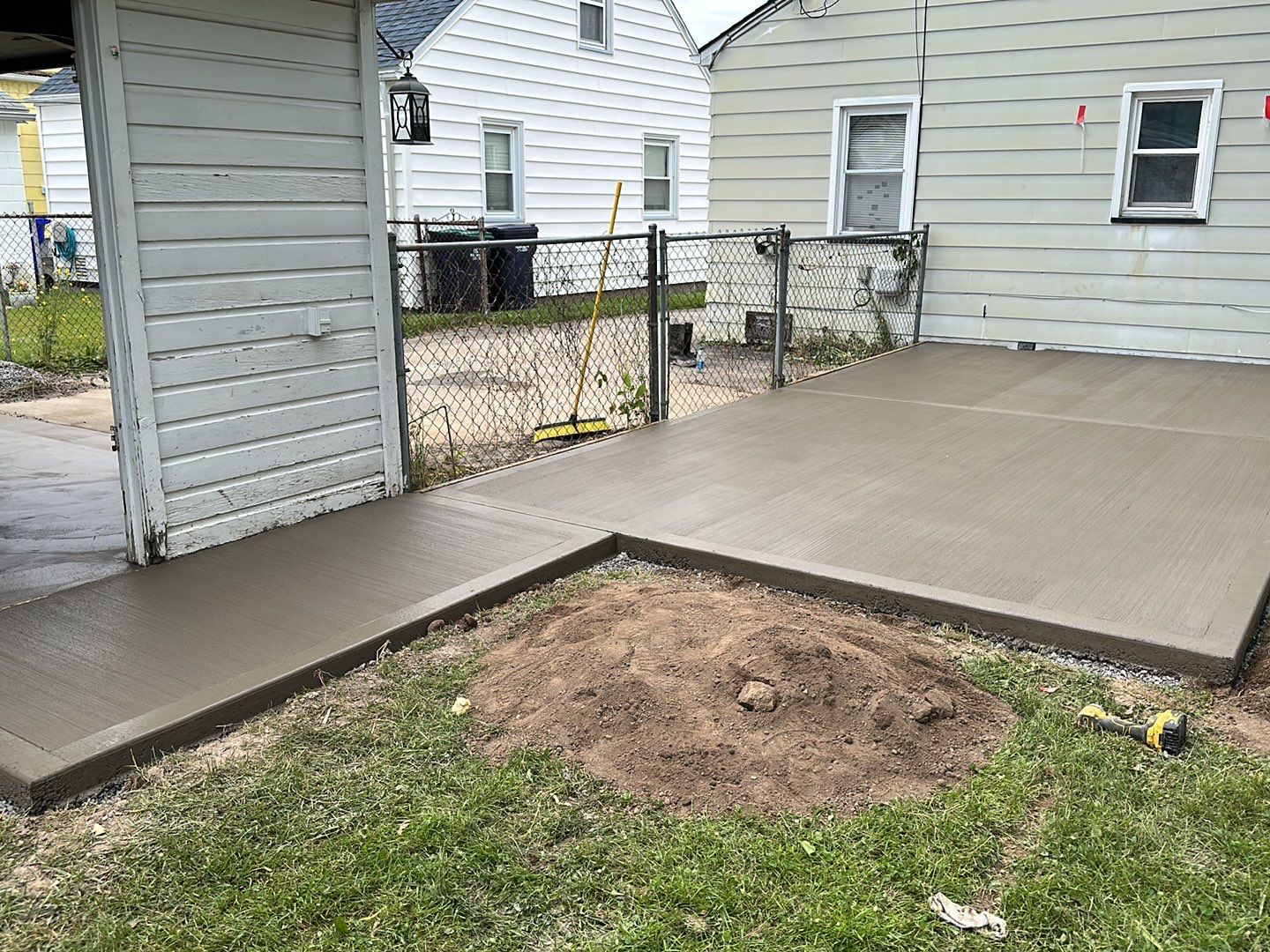 Broom finished patio and garage floor replacement  by NG Masonry & Construction LLC