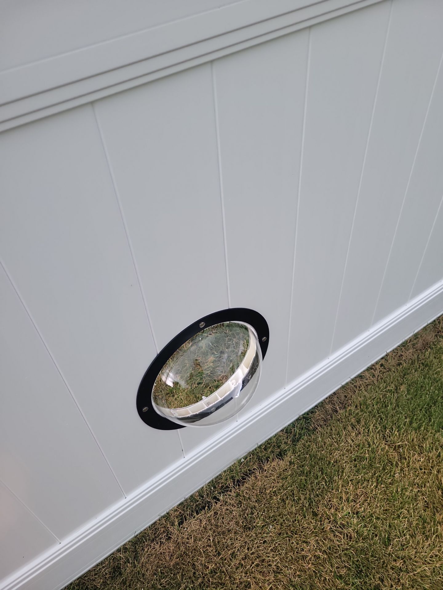 White Vinyl Privacy Fence With Pet Window in Cedar Falls by Perfect Picket Fence and Stain