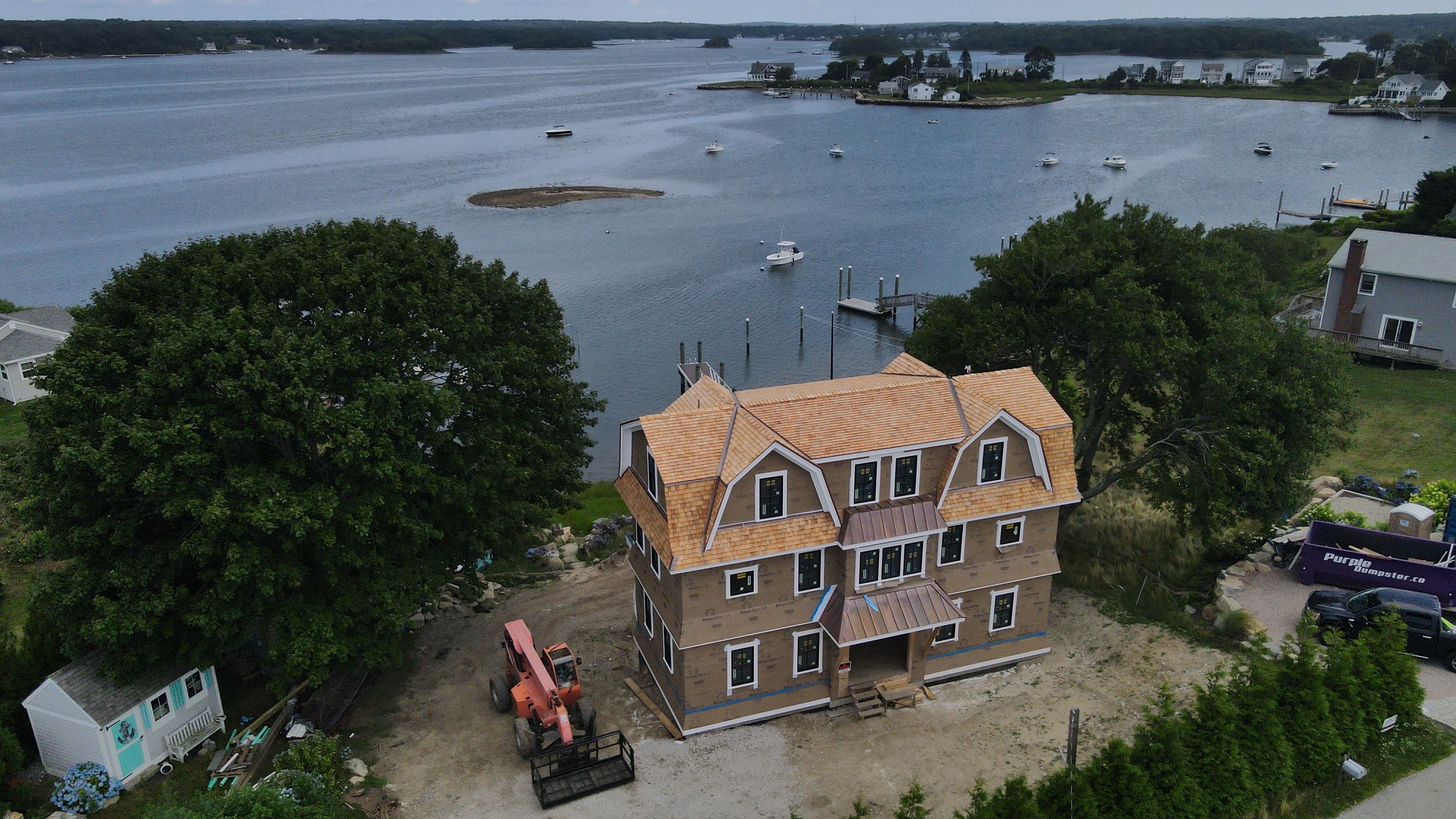 Great Island - Red Cedar Roofing, Yellow Cedar Siding, Standing Seam Copper, & Copper Gutters  by Rinaldi Brothers