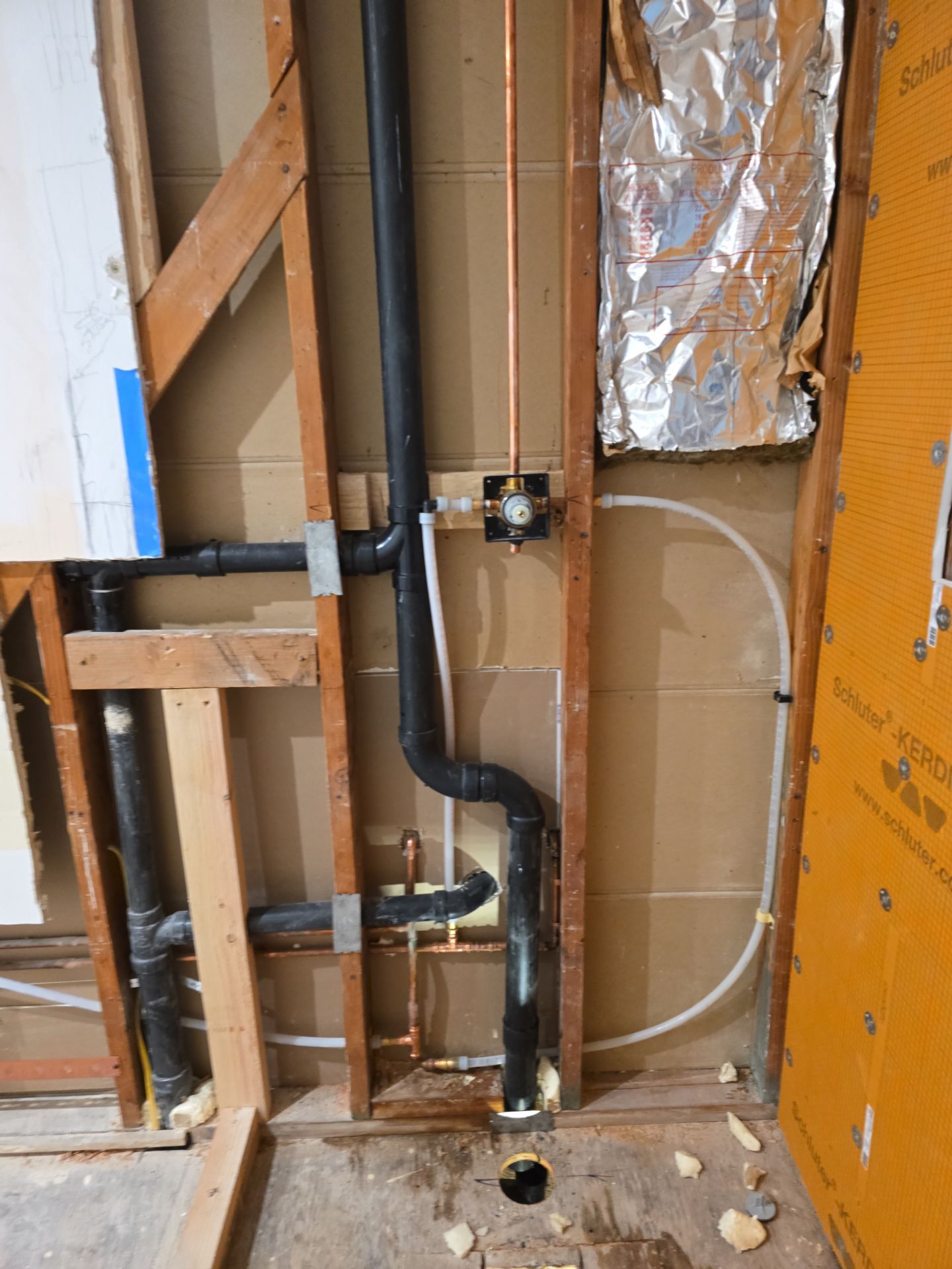 Installation of New Tall Black Piping (Wall to Ceiling) & Underground Piping by Us Plumbing