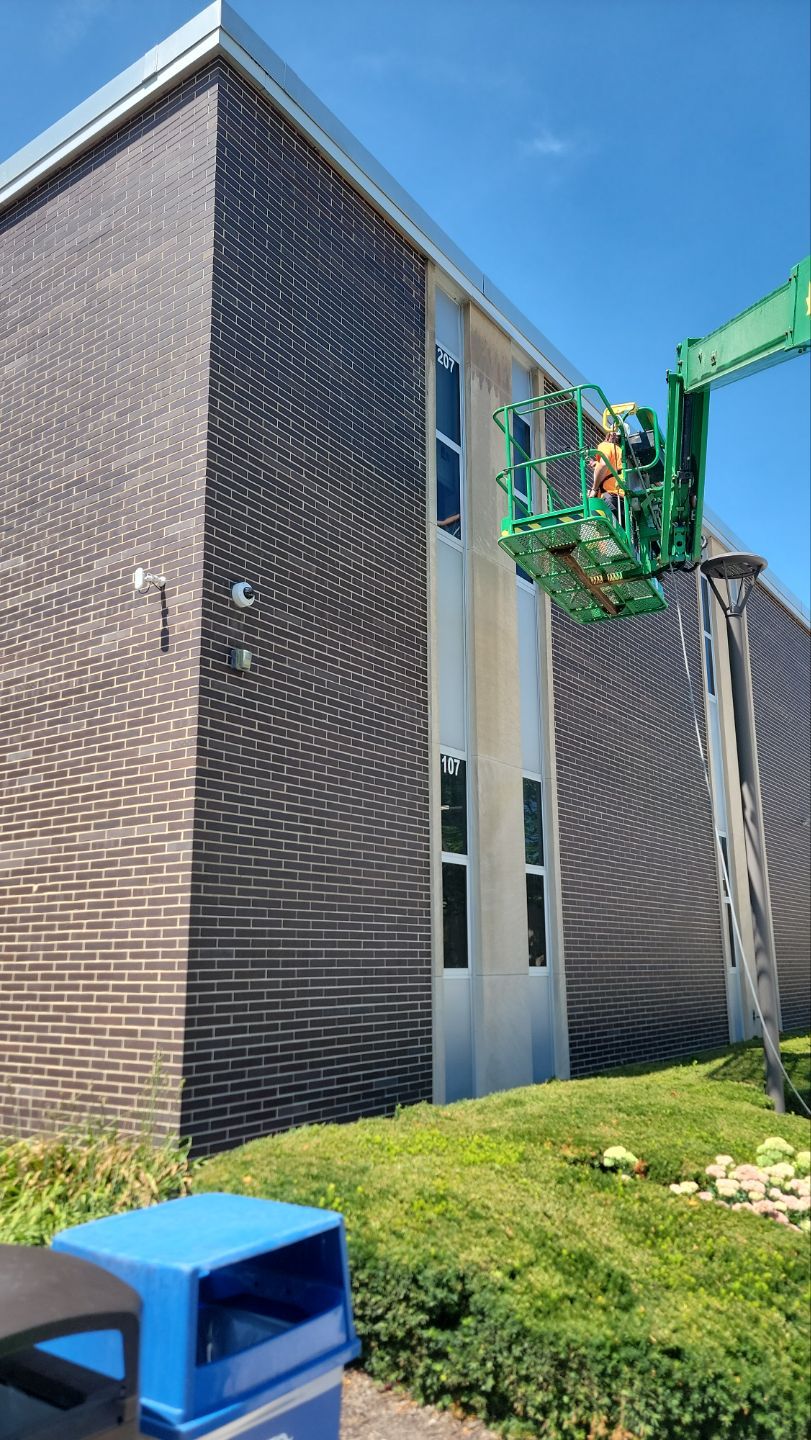 commercial pressure washing using Algaecide, soft wash soap by Northern Power Washing LLC.