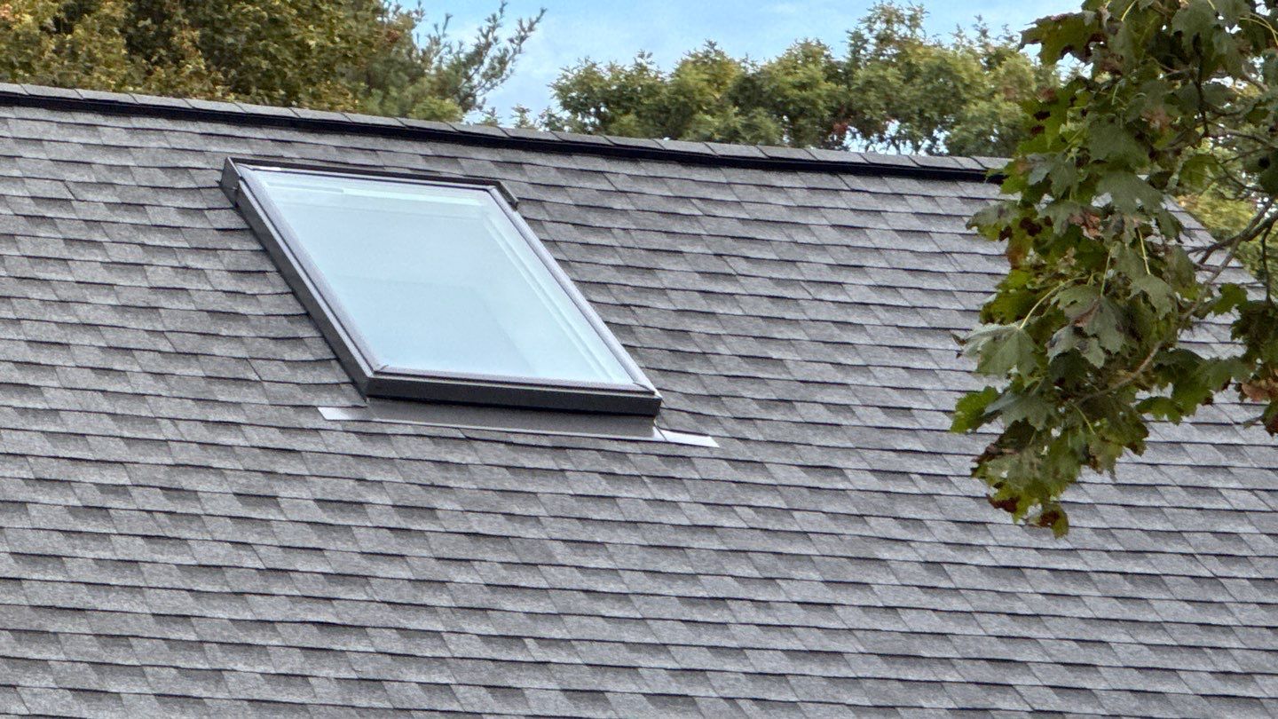 Complete Roof Replacement with GAF Pewter Gray HDZ™ Shingles, VELUX Skylights & New Gutters by Sensible Home Solutions