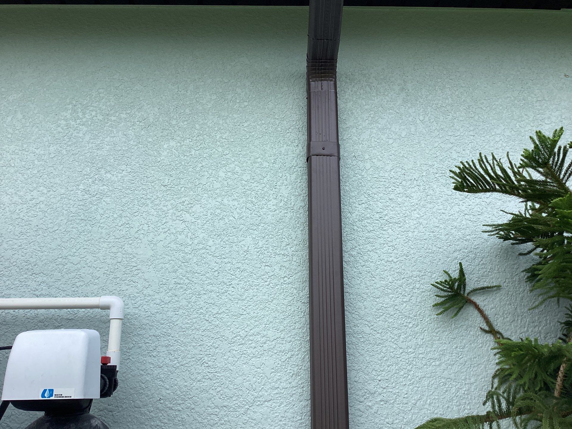 Musket Brown and New Downspouts in Lehigh Acres, FL  by Gutter Professors