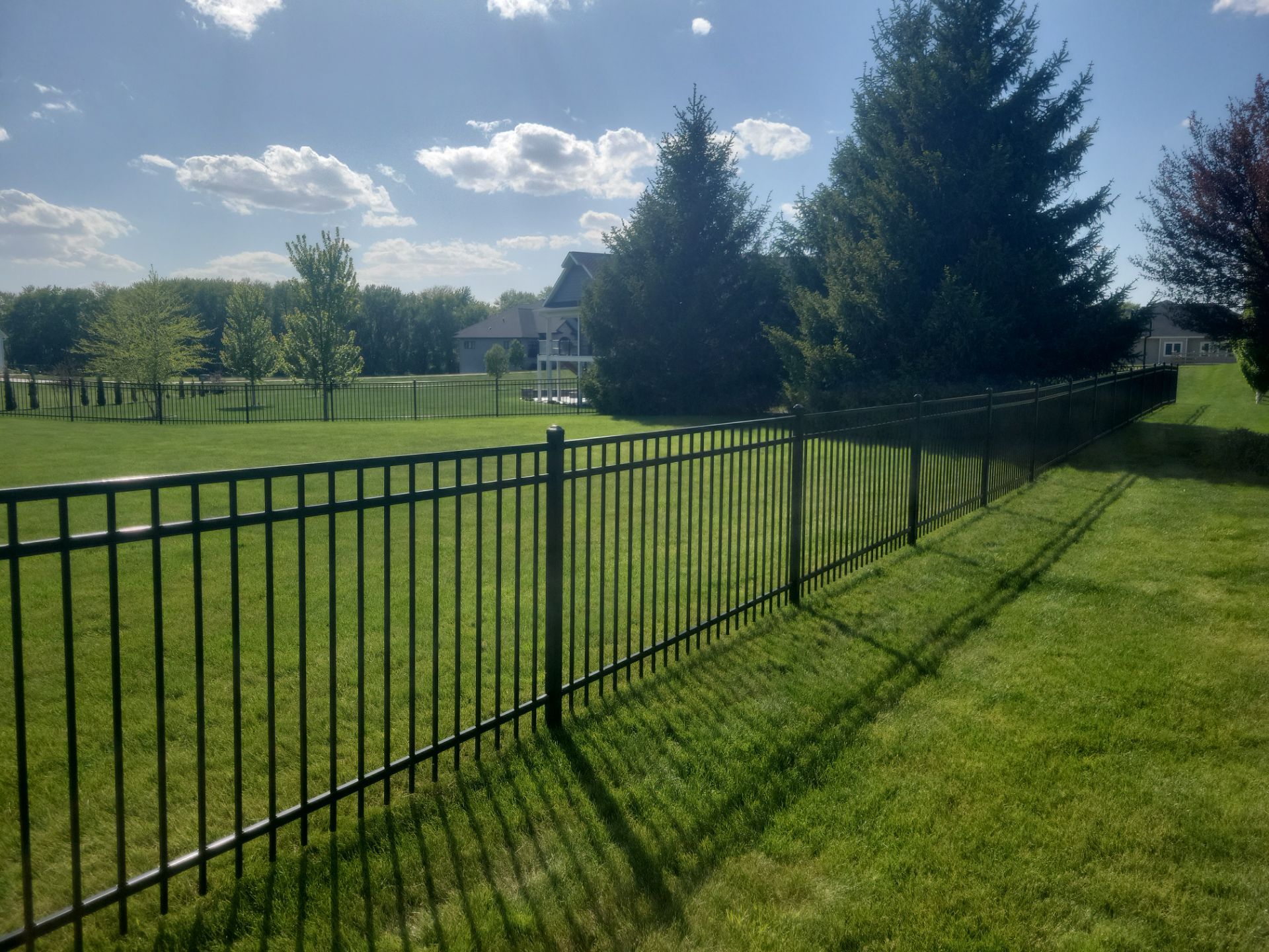 Black Ornamental Metal Picket Fence Installation in Waterloo by Perfect Picket Fence and Stain