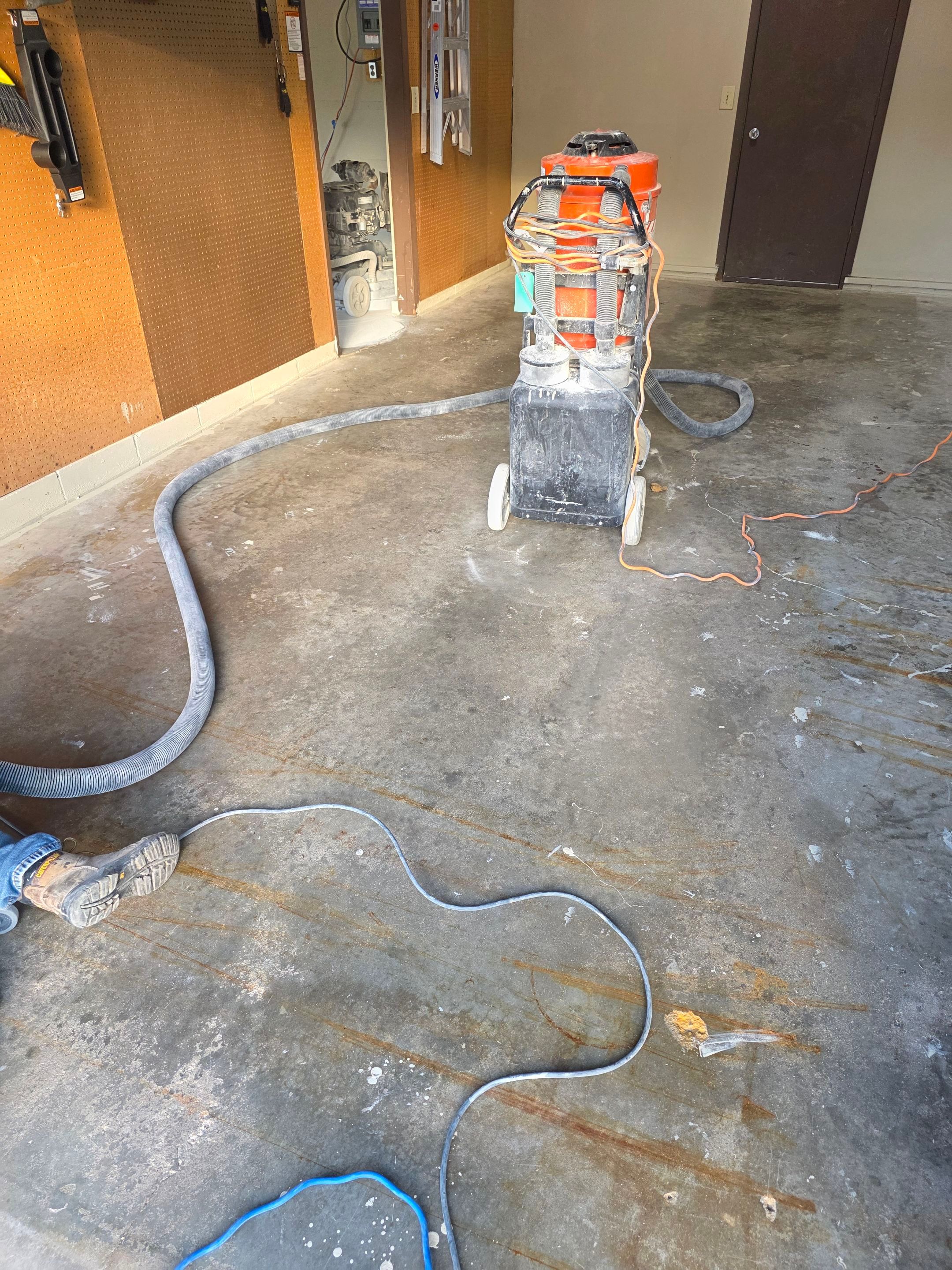 Residential Garage Epoxy Floor Coating Installation in Sioux Falls by Select Painting, Coatings & Garage Cabinets