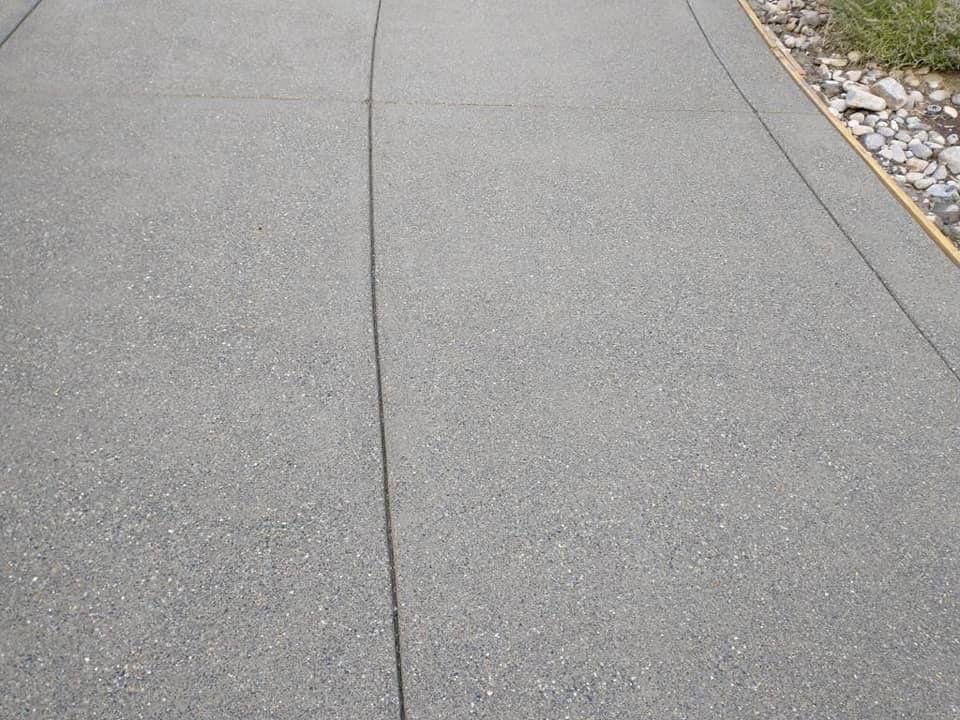 Cristi | Sand Finish Concrete Driveway  by Jireh Asphalt & Concrete Inc 