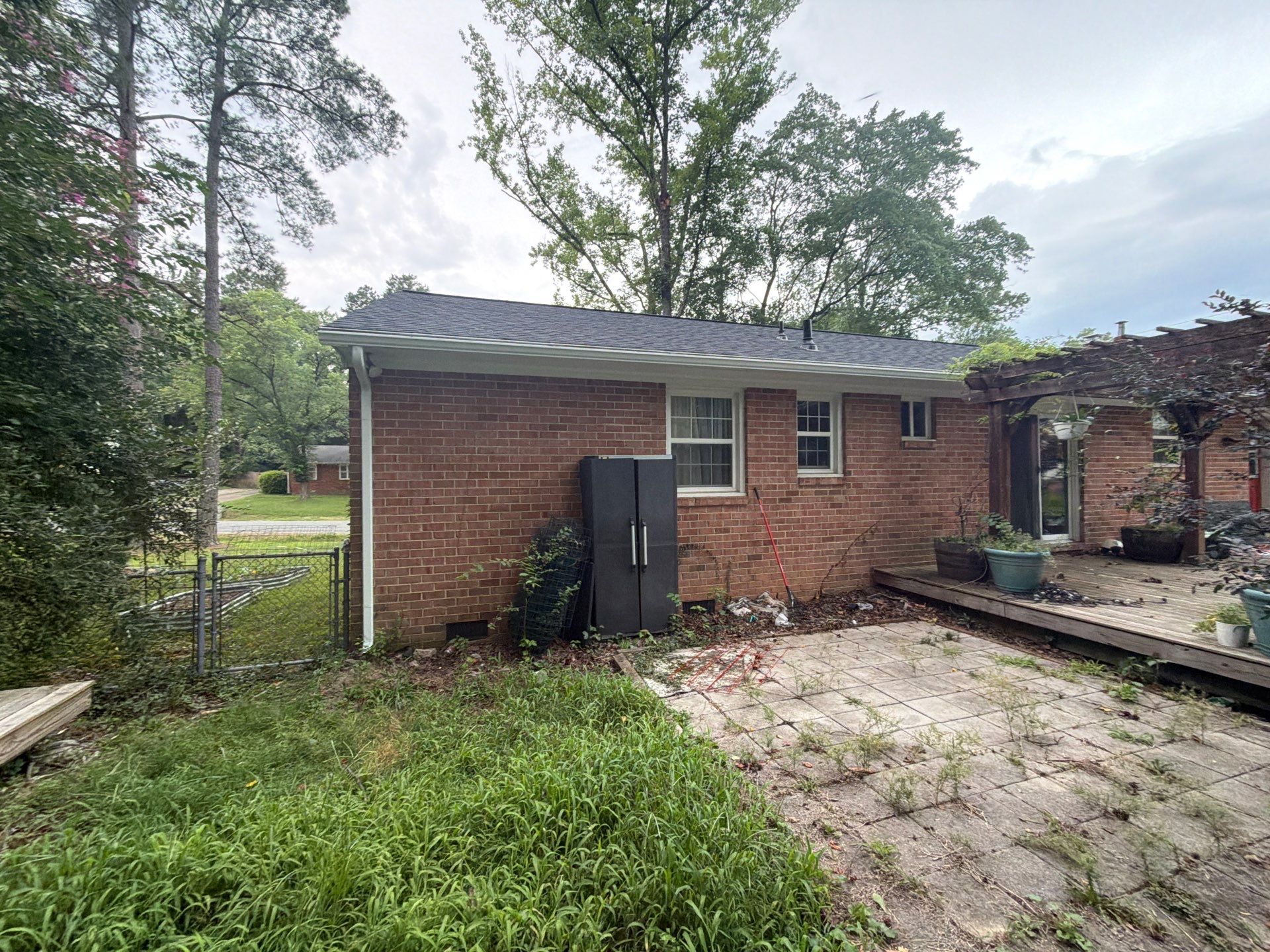 Asphalt Shingle Roof Replacement and Gutter Installation in Richmond by Cade Construction