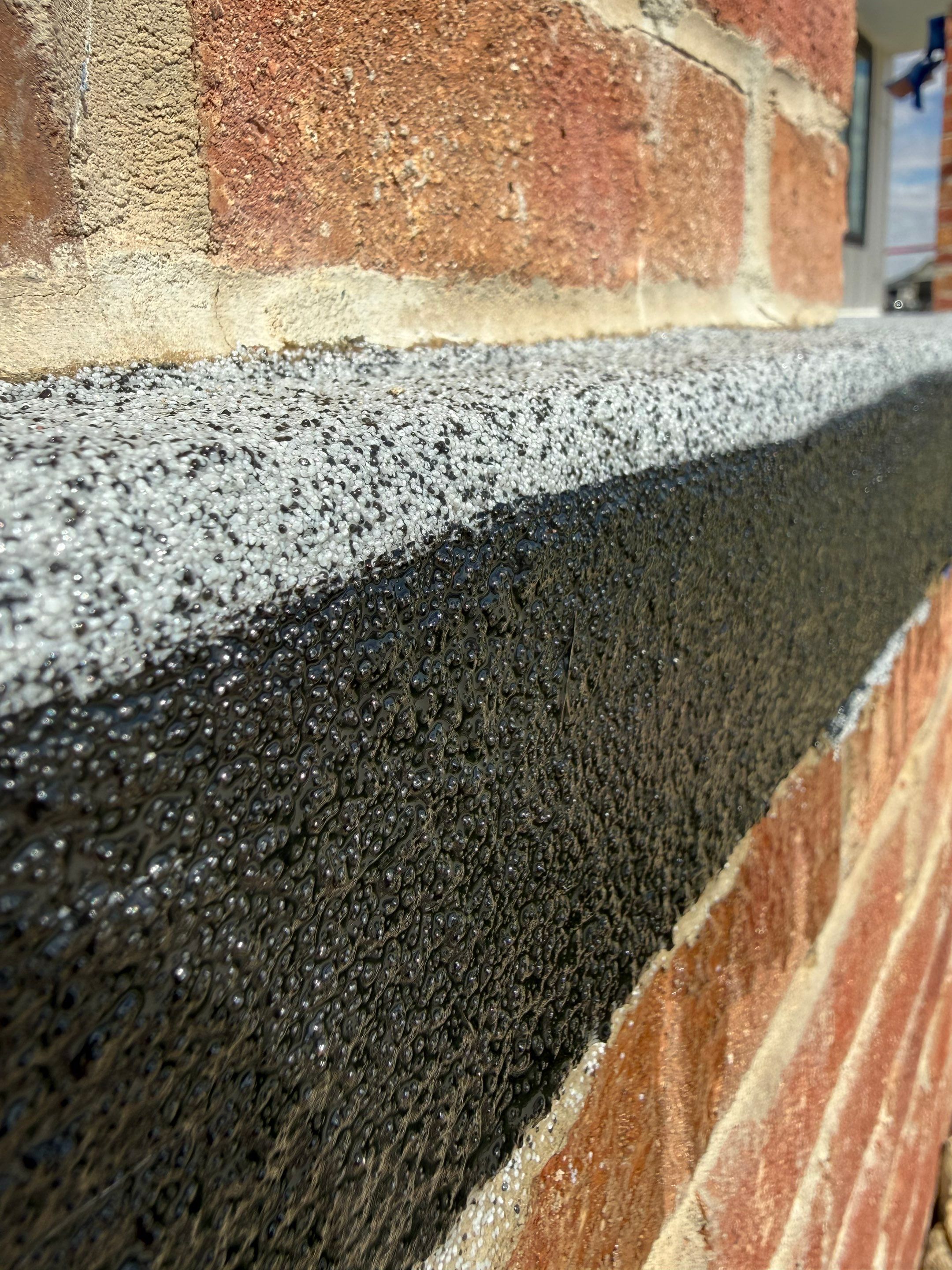 Grey Speckled Concrete Porch Coating for Sioux Falls Home by Select Painting, Coatings & Garage Cabinets