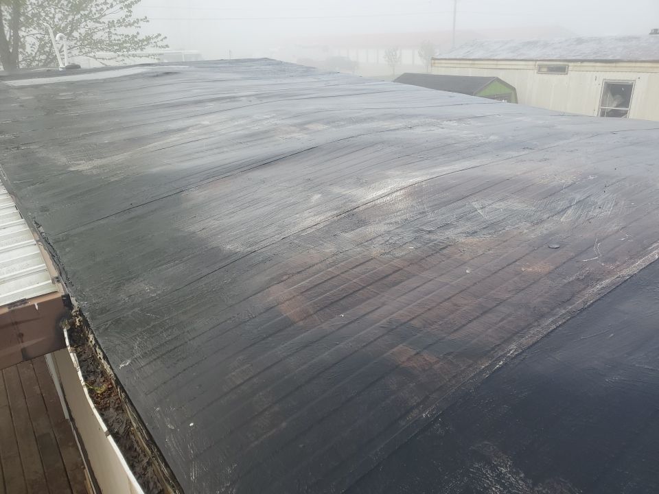 Residential Roofing Installation using 60 mil rubber roof  by Nitro Roofing and Construction