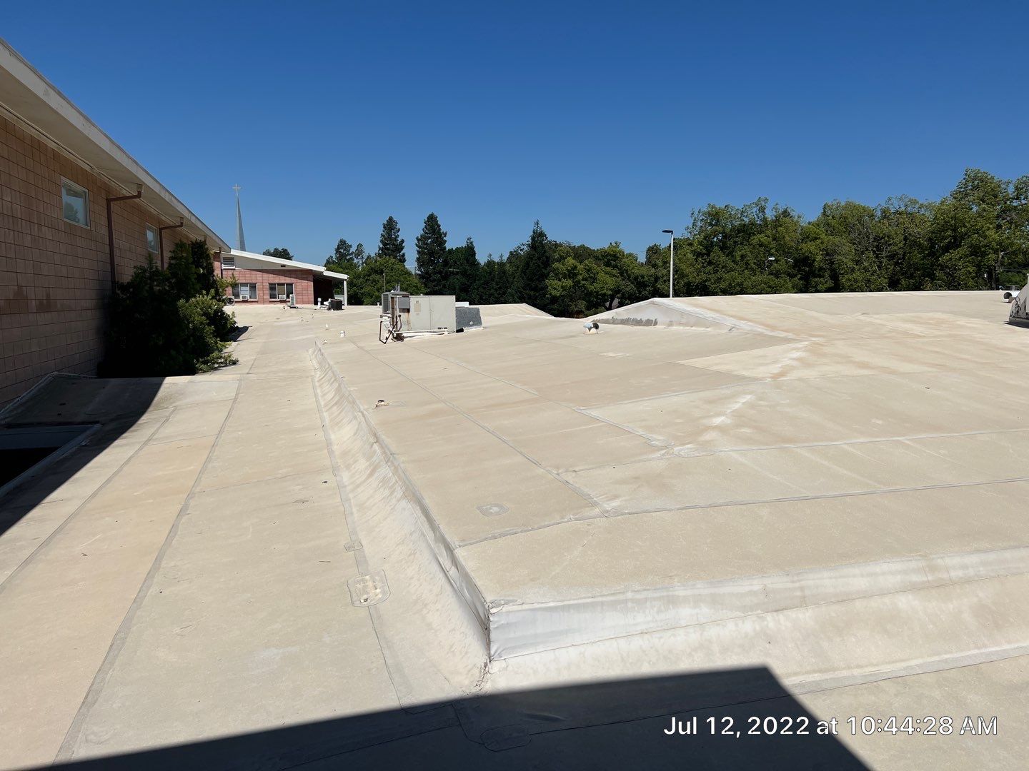 MR Roofing system using Benchmark/PUMA XL coatings over TPO single-ply roofing by Straight Edge Roofing Inc