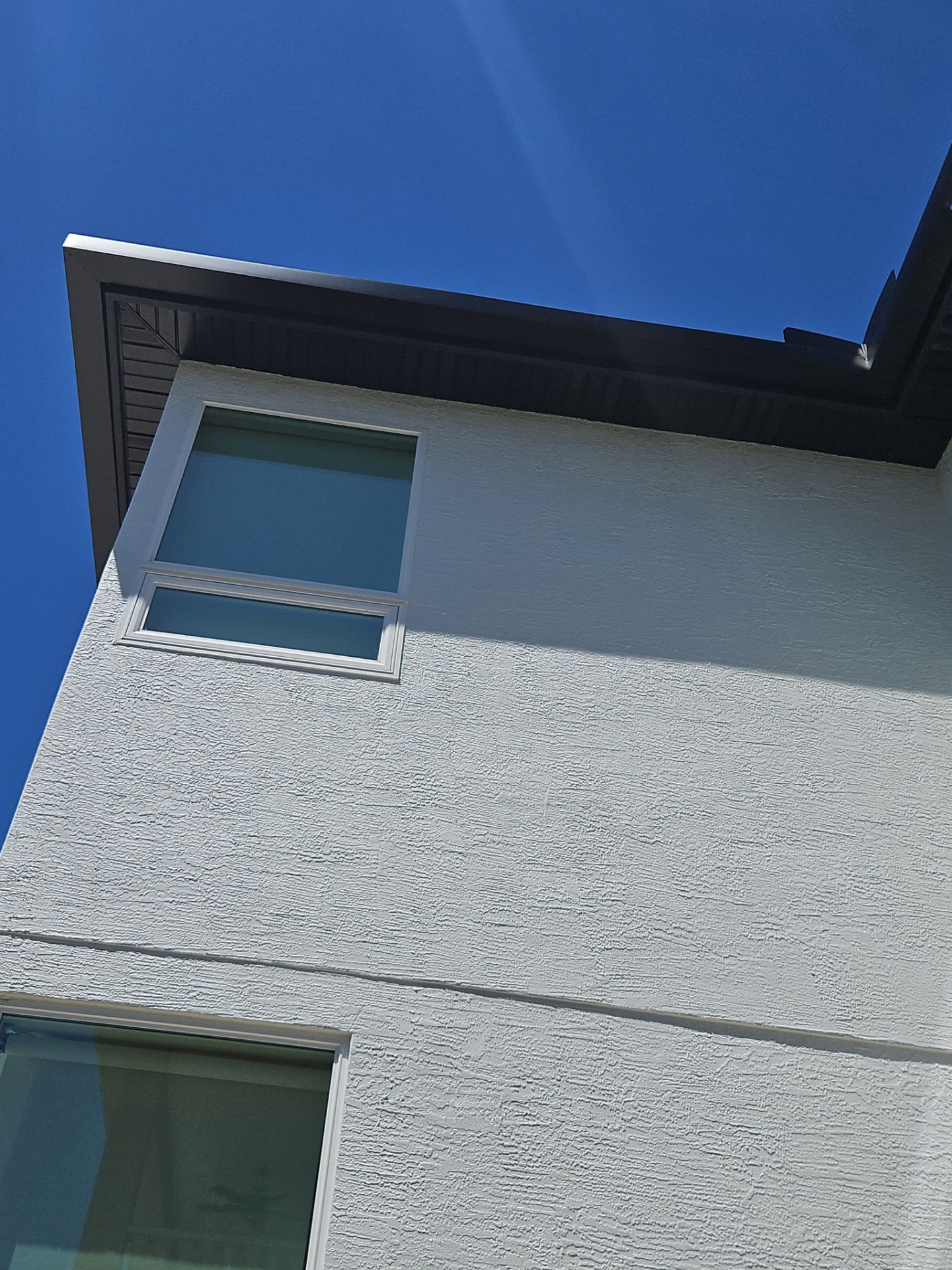 Soffit and Fascia Installation and black seamless gutters in Sarasota FL by Gutter Professors