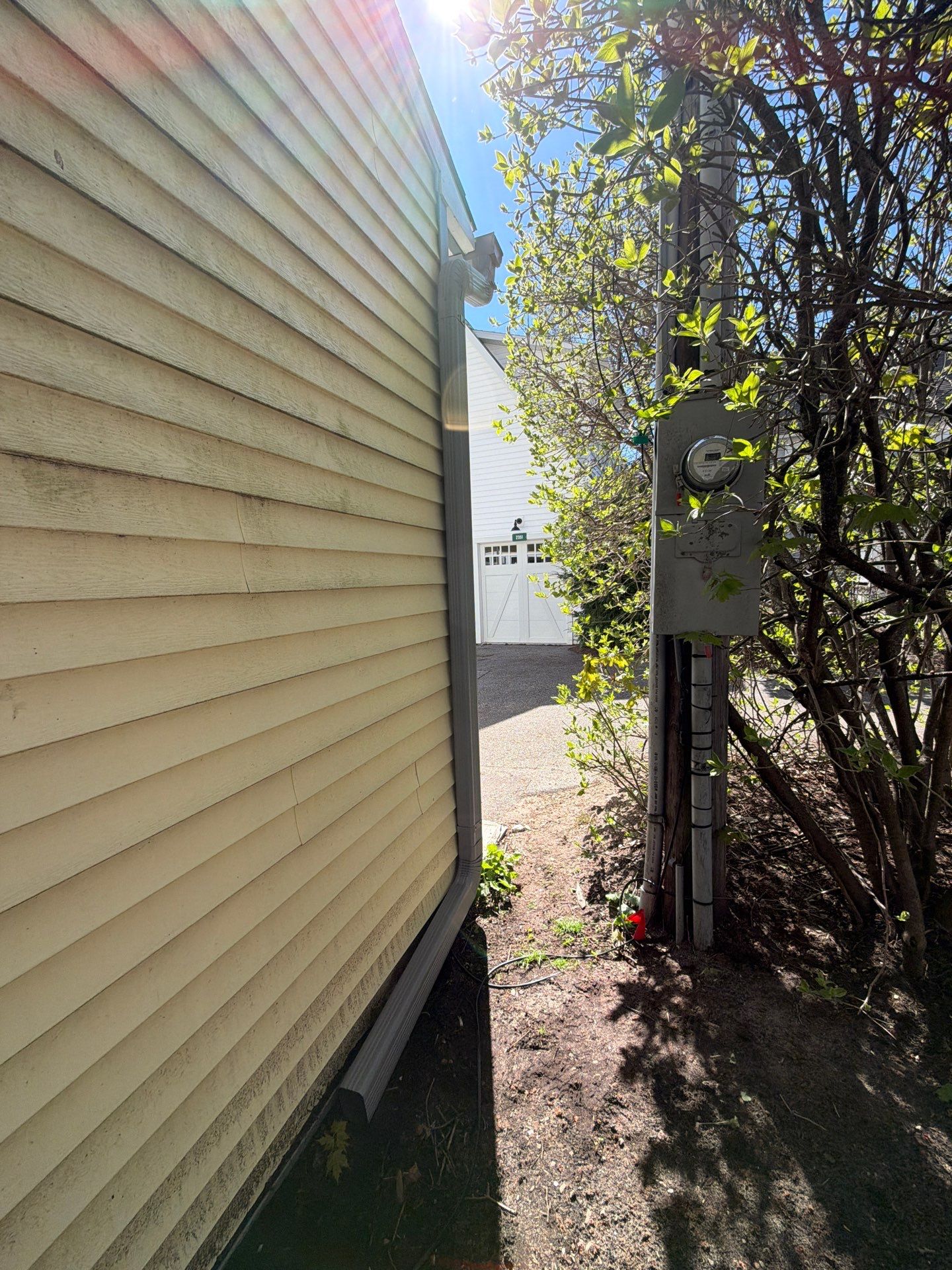 Dark Gray Aluminum Gutter System Installation in Harbor Springs by Rainbow Seamless Systems