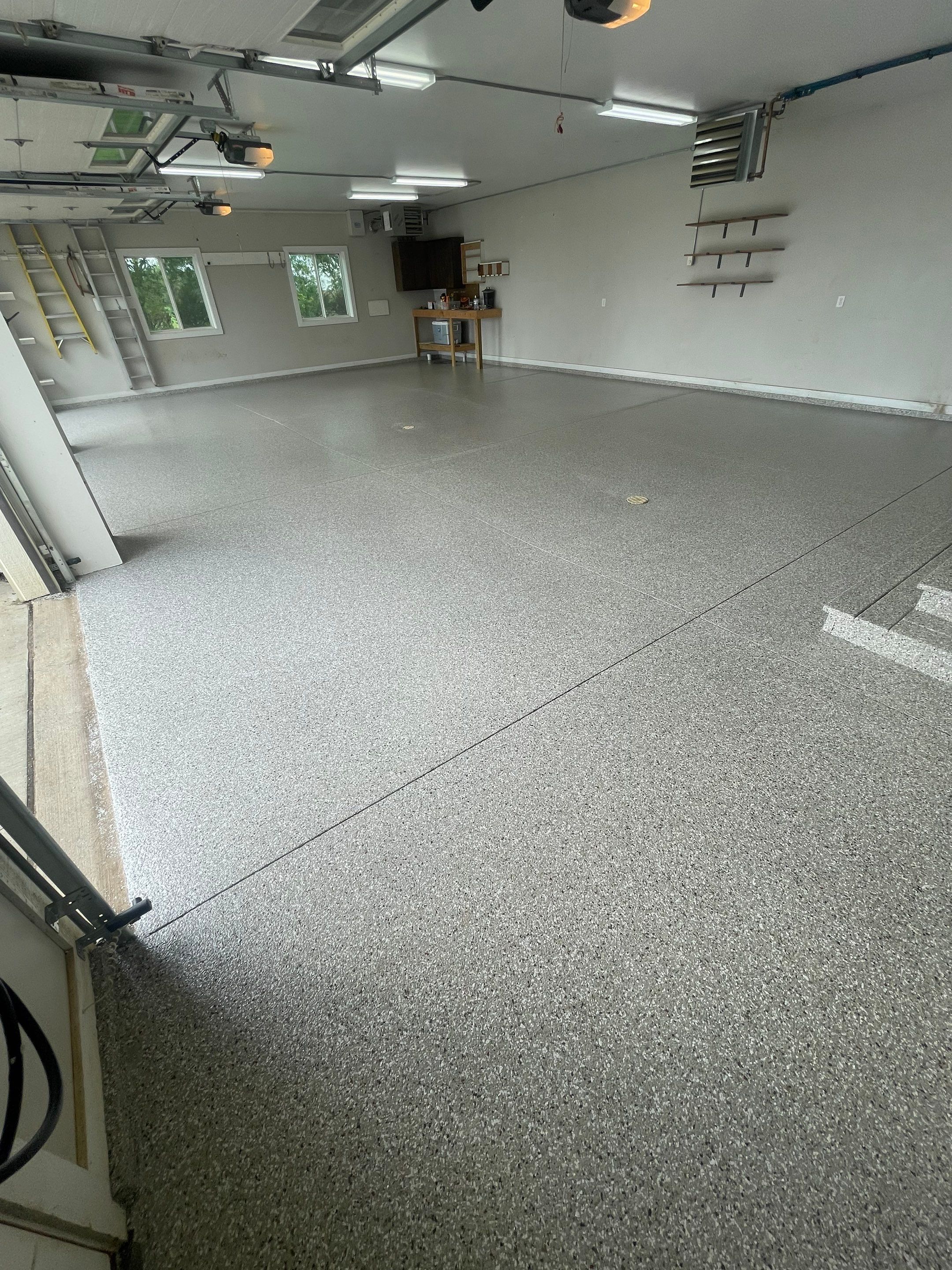 Grey Speckled Polyuera Garage Floor Coating for Hartford Three-Car Garage by Select Painting, Coatings & Garage Cabinets