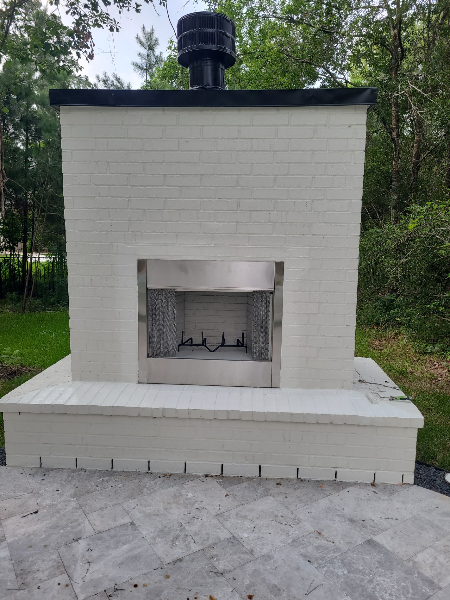 Outdoor Fireplace in Tomball, TX by SophAlx LLC