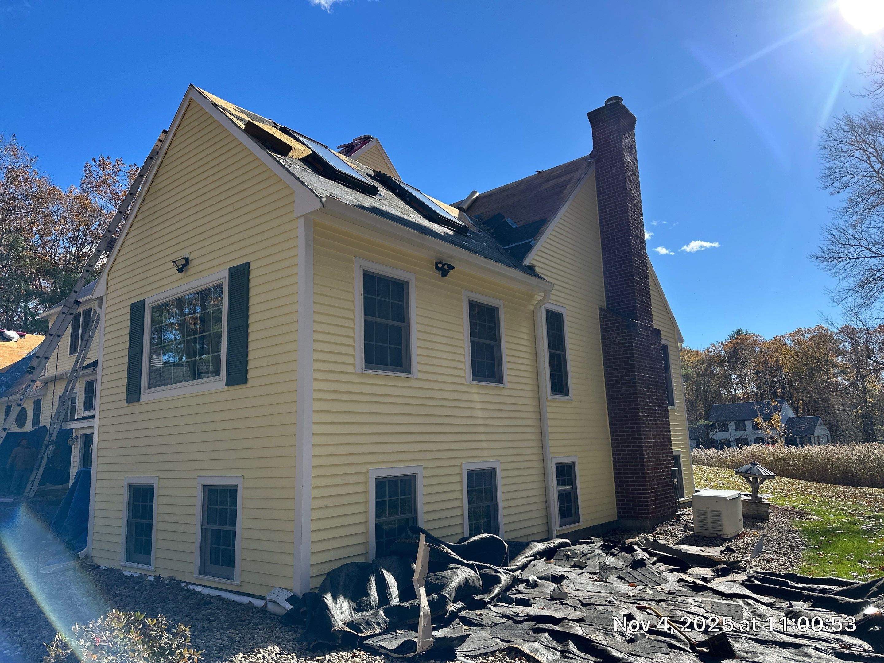 Chelmsford Premium Roof: Onyx Black Shingles with Standing Seam Metal Porch by Mighty Dog Roofing of Greater Middlesex County