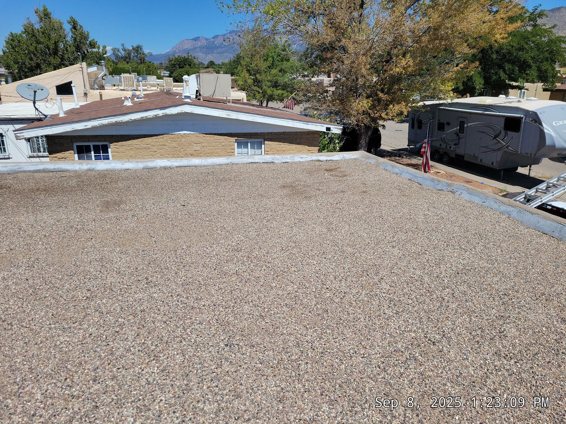 Albuquerque Flat Roof Replacement Using Tan Modified Bitumen Membrane by Doyle Roof Masters Inc