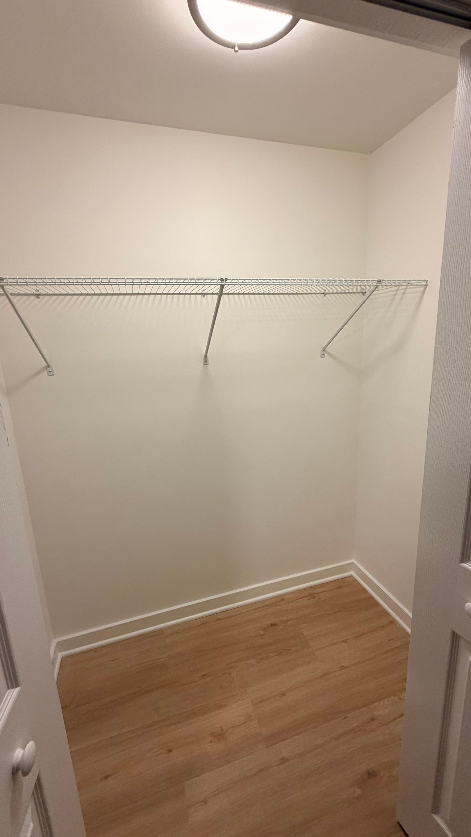 Basement Remodeling with Wood-Look Flooring and Custom Wainscoting in Dunwoody by Swift Home Renovations