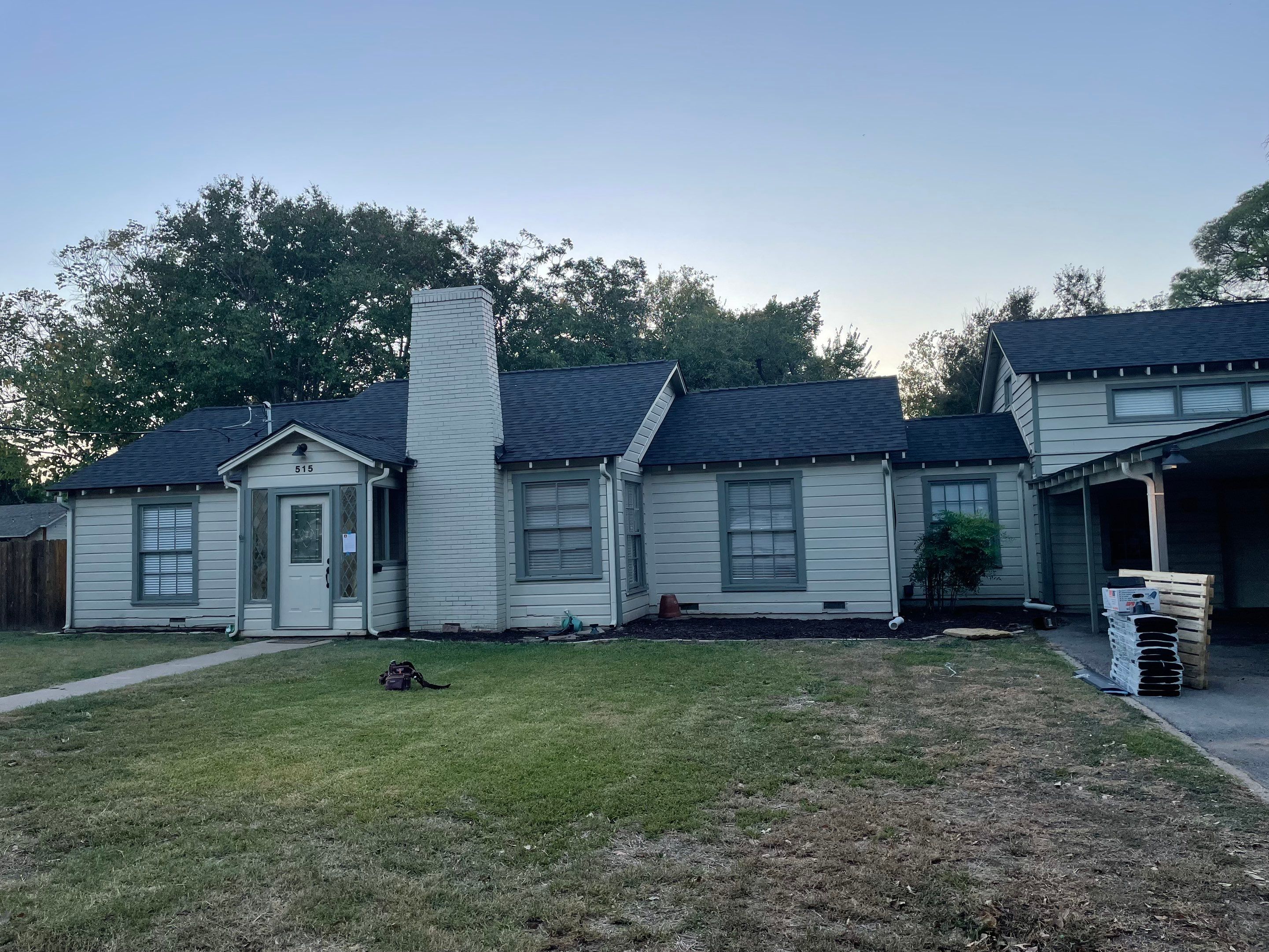 White exterior with IKO Glacier by Tejas Roofworks + Restoration
