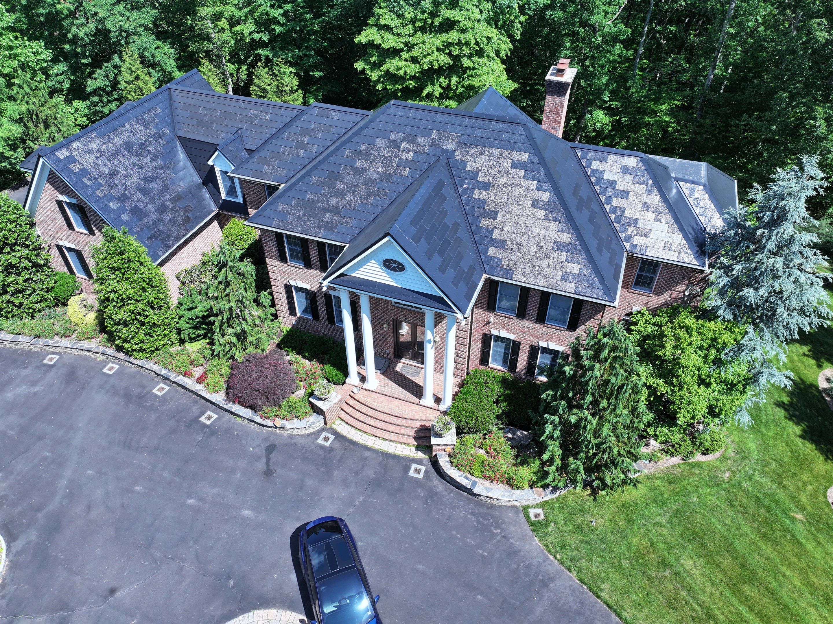Tesla Solar Roof Replacement by American Home Contractors