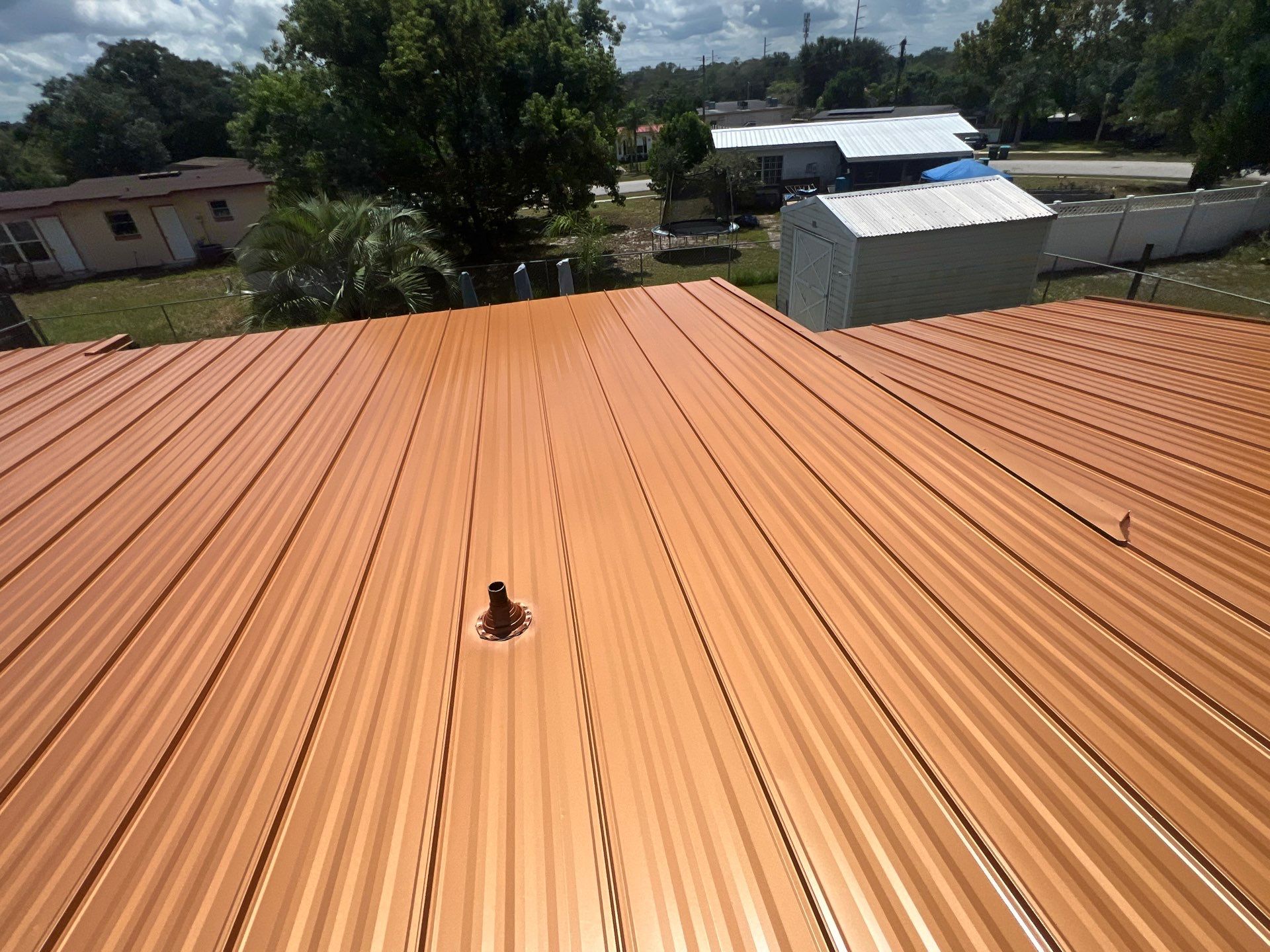 Standing Seam Metallic Copper Metal Roof Replacement in Deltona by Pinnacle Roofing Group