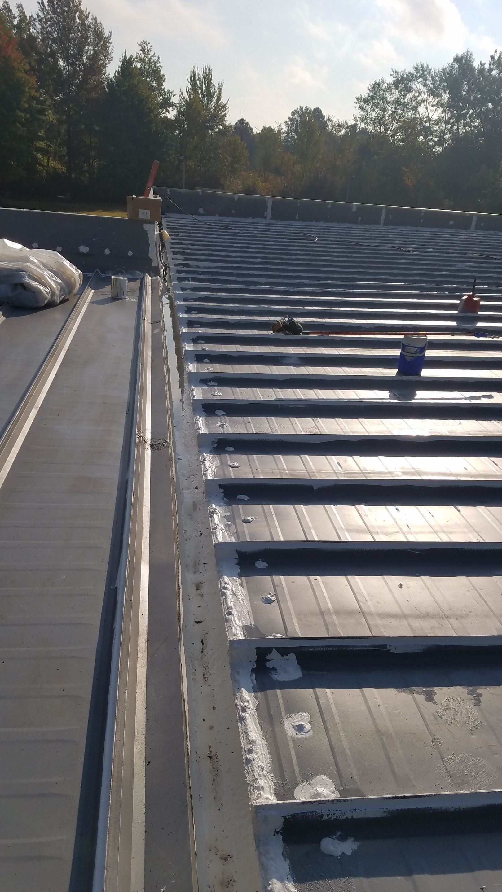 Commercial Metal Roof Coating by Gold Star Roofing LLC