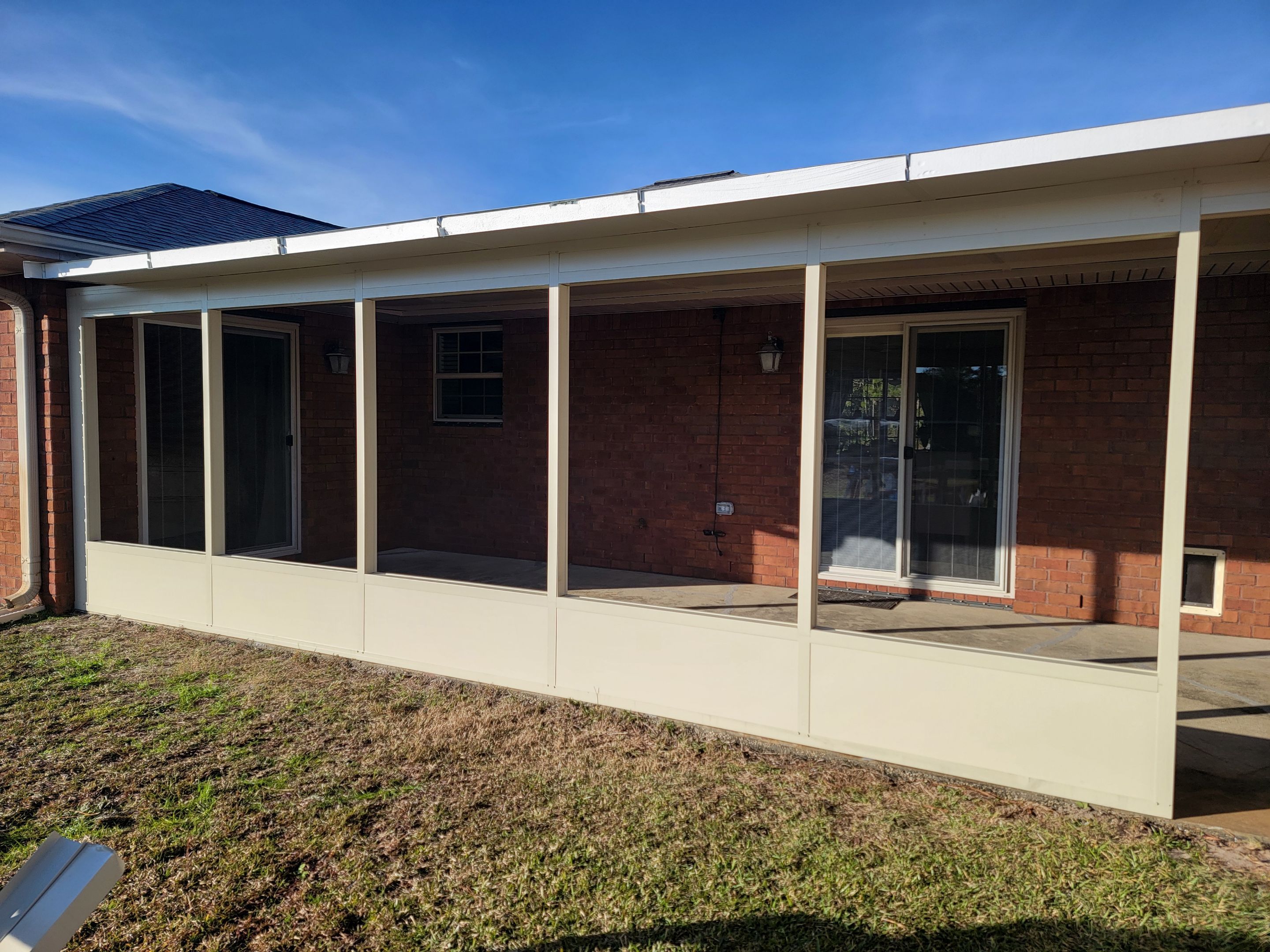 Enclosure w/Vinyl Windows using Colorbeam by Titan Sunrooms