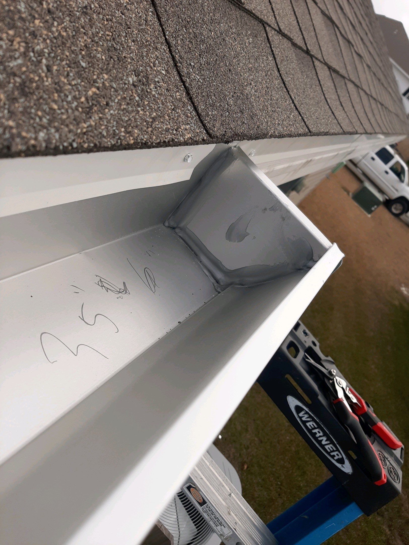 Seamless Gutter Installation Using White 6 Inch Gutters by Gutter Professors